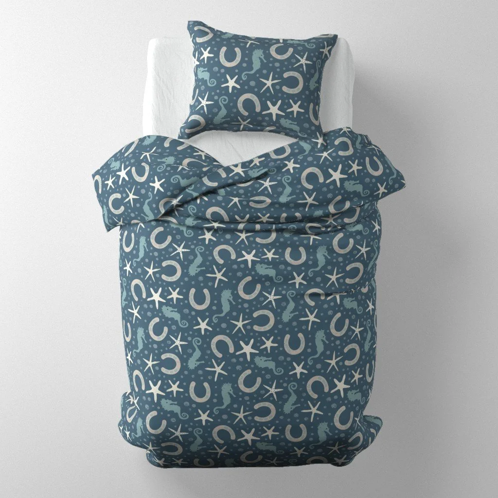 Seahorses, starfish, and horseshoes in a distressed scatter —this coastal cowboy pattern fuses ocean charm with Western spirit in a playful, breezy style.