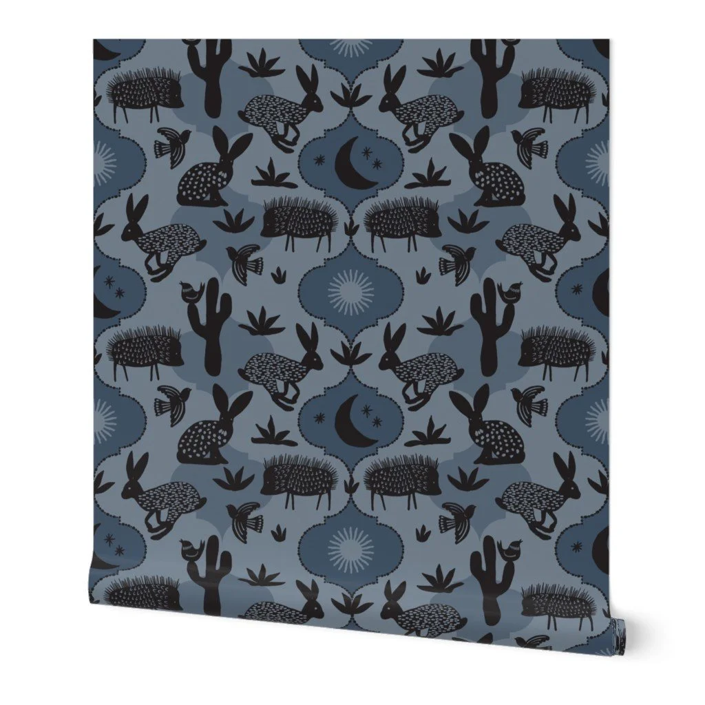 Lino-print jackrabbits and javelinas in a stylized Sonoran desert—perfect for bold, modern wallpaper and cozy home decor.