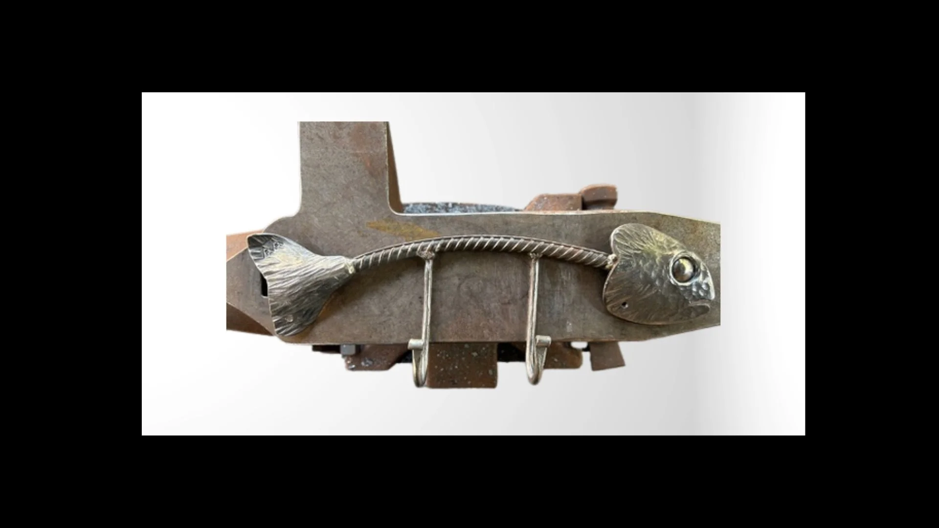 Fish coat hook sculpture (~16 inches).