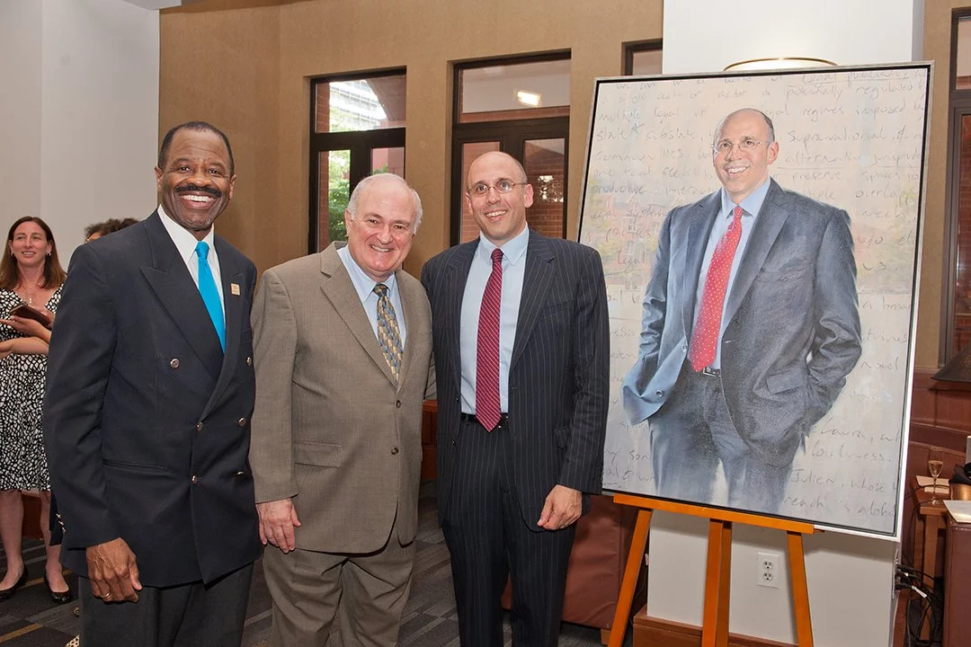 Former Dean Paul Schiff Berman with Dean Blake D. Morant and GW President Steven Knapp during the official unveiling of Paul Berman's portrait on June 29.