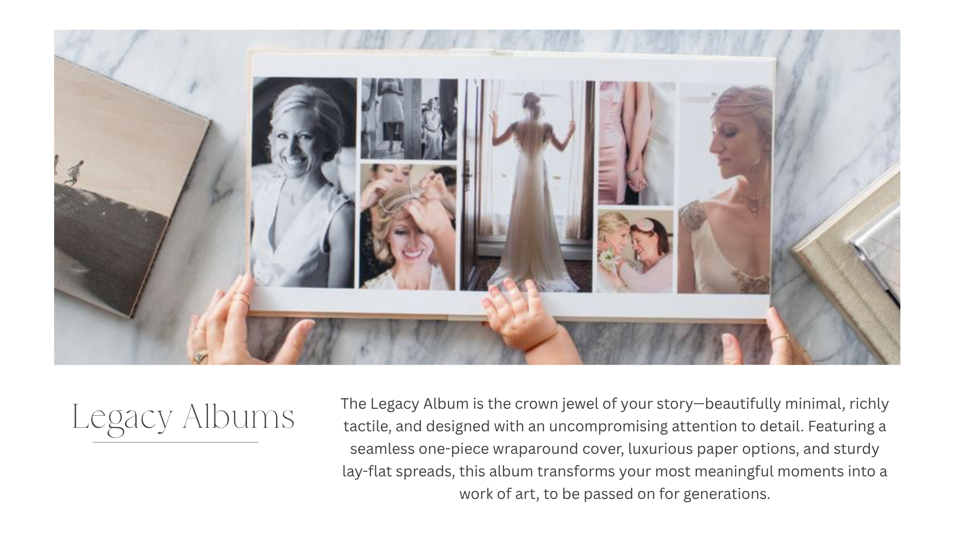 A person holding an open photo album with several photographs of women, including a bride, on a white marble surface. The album has a minimalistic design.