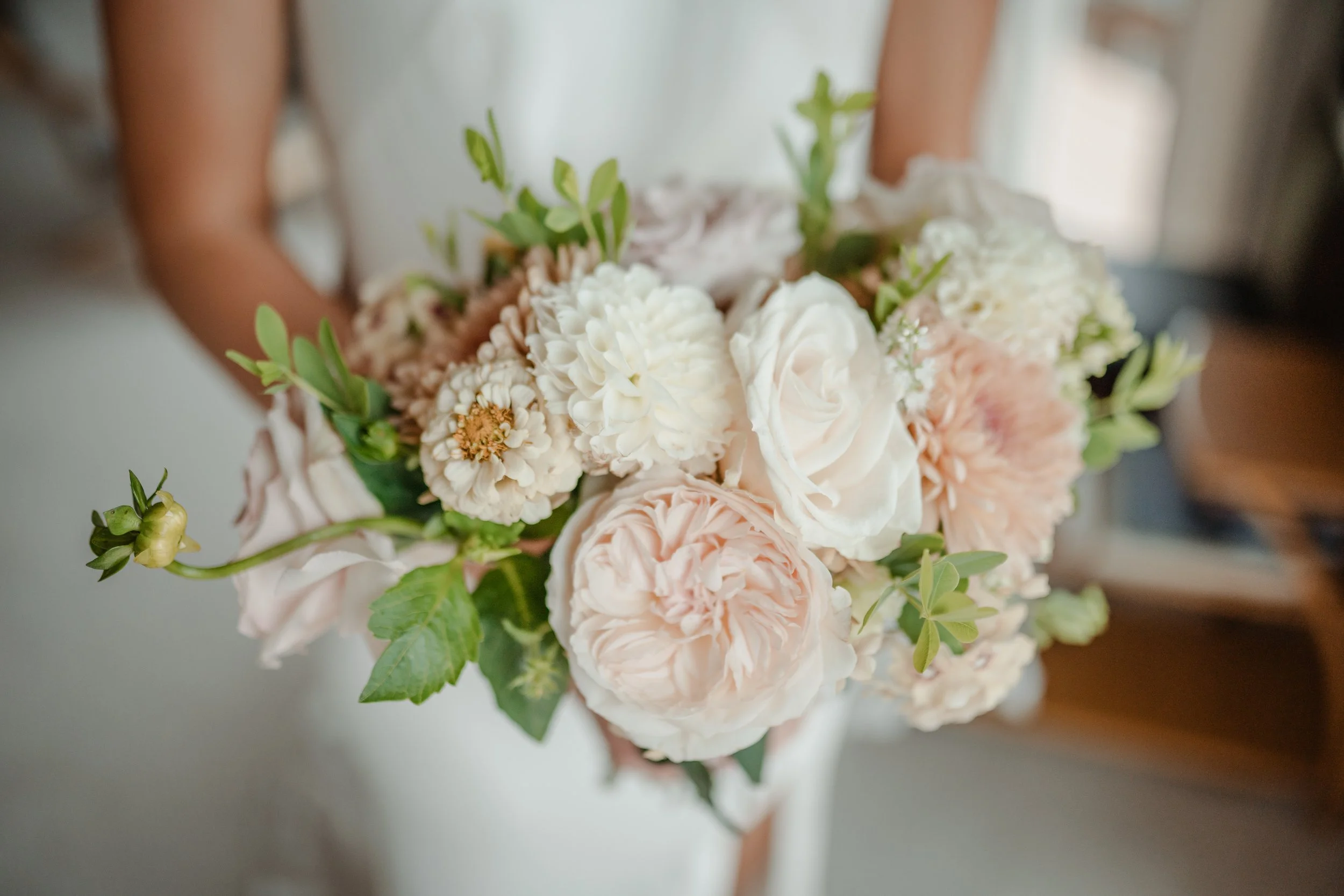 Bridal bouquet with blush pinks, whites, and greenery