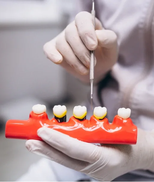 Dentist discussing dental implant treatment with patient in irvine