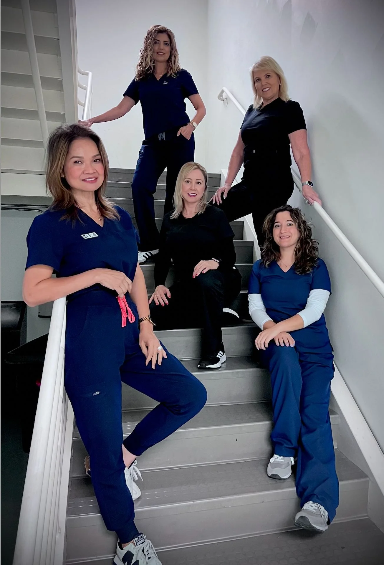 Sand Canyon Dental team on the office stairs - Irvine dentist staff