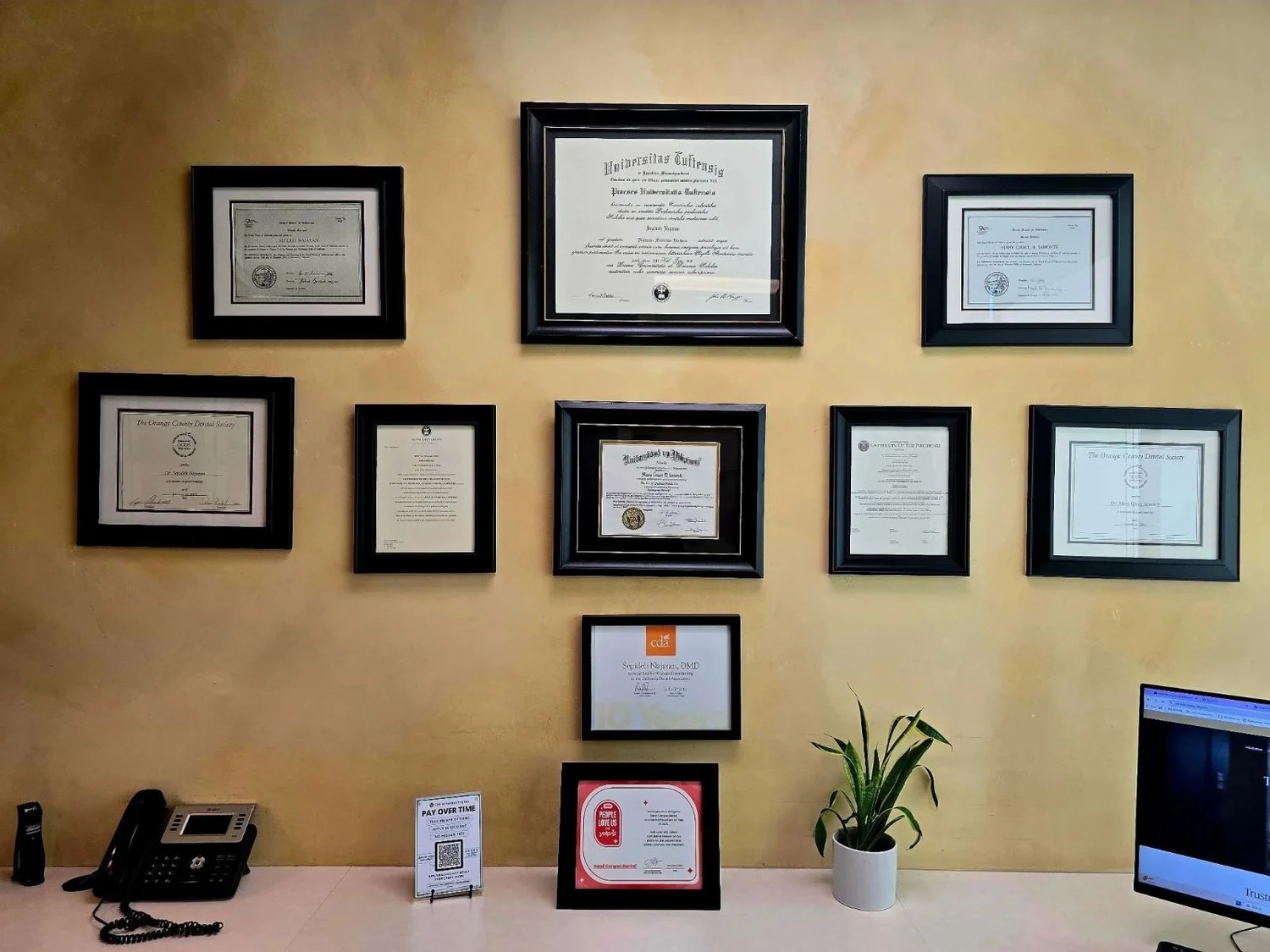Diplomas on the wall of the Sand Canyon Dental office in Irvine