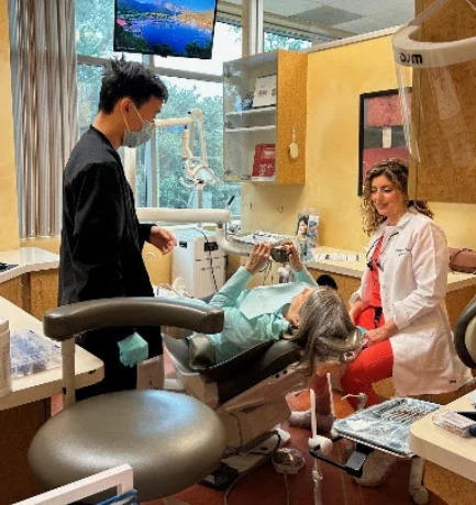 Dentist examining a patient's tooth in Irvine