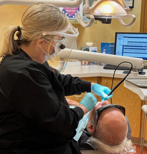 Dentist discussing dental care with patient in Irvine