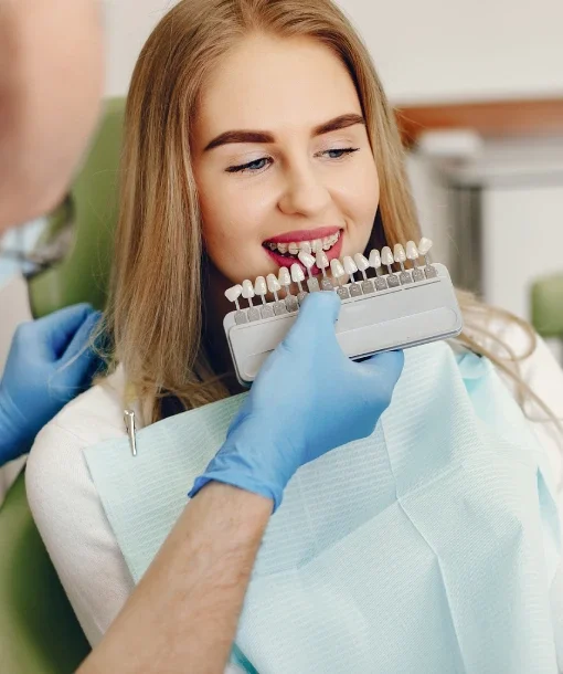 Dentist evaluating missing tooth replacement options