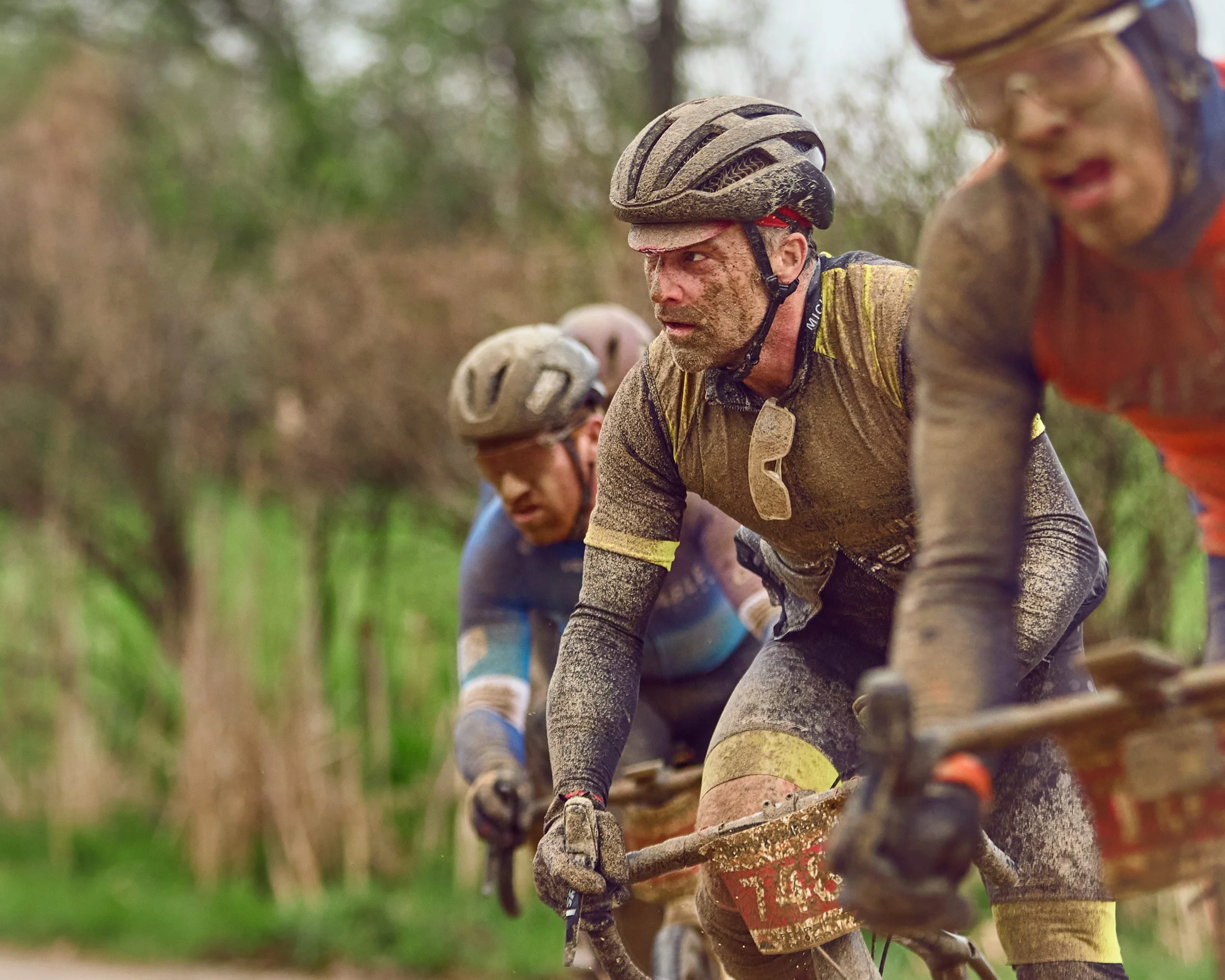 Cyclists on muddy trail Barry Roubaix 2026, Hastings Michigan, gravel race event photography