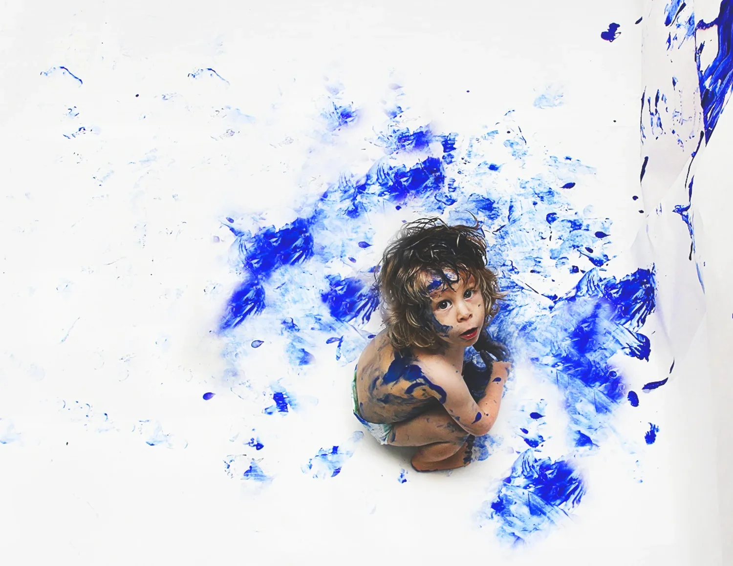 Alicia Levy Photography children portrait little boy with blue paint