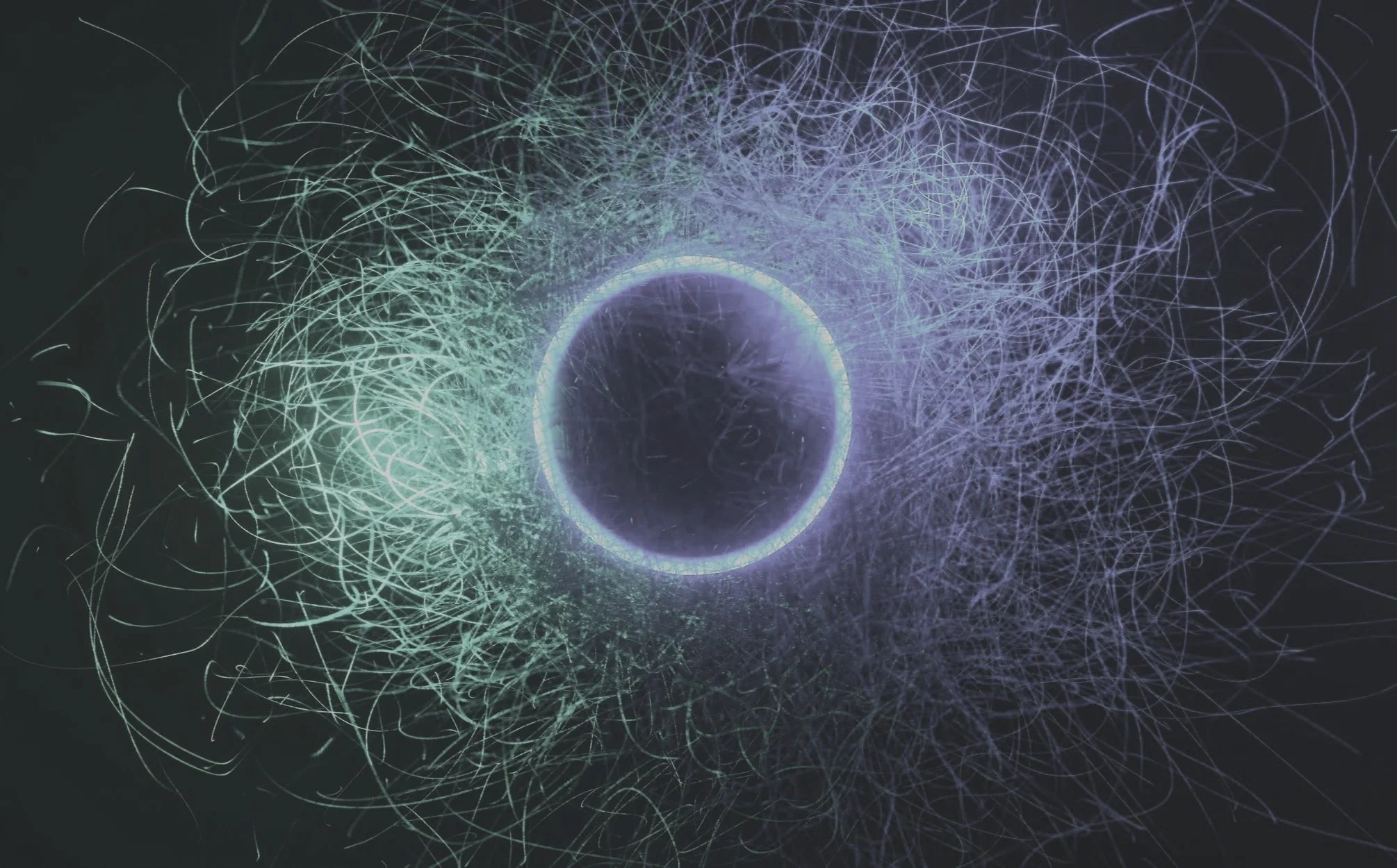 Digital abstract artwork featuring a glowing blue circle at the center surrounded by intertwined light lines on a dark background.