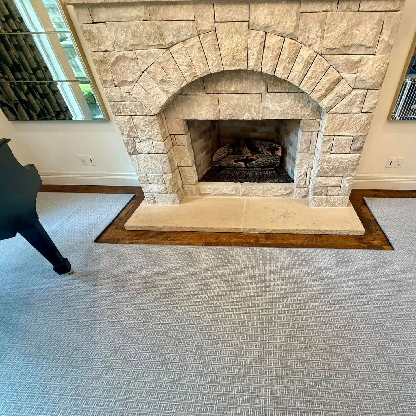 No room for a standard rug? No problem. This custom-templated broadloom was created specifically for this space, flowing seamlessly around the fireplace hearth. Cut to the exact shape and finished with a durable, serged edge, this rug shows what&rsqu