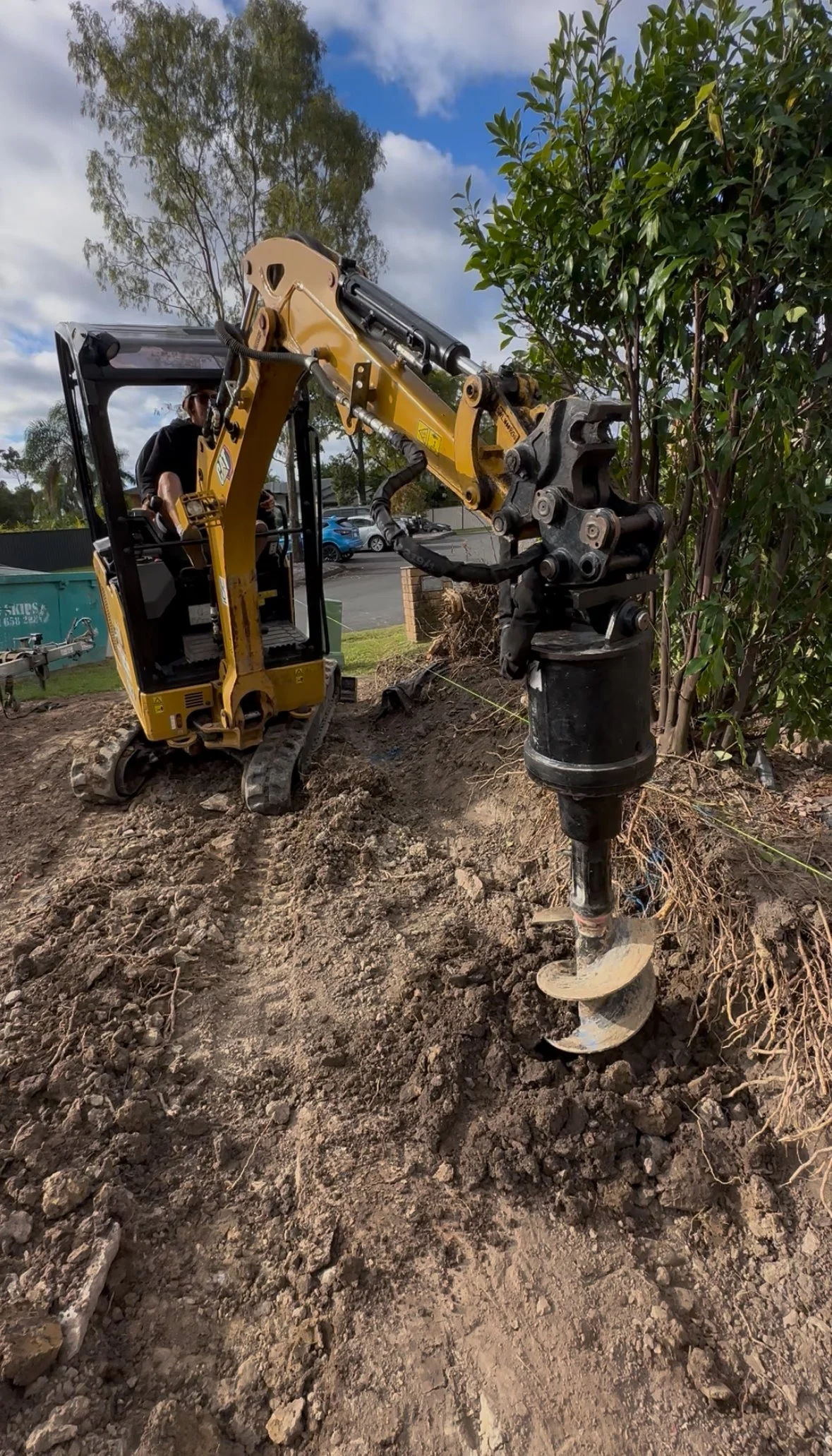 Excavation for retaining wall base in Helensvale