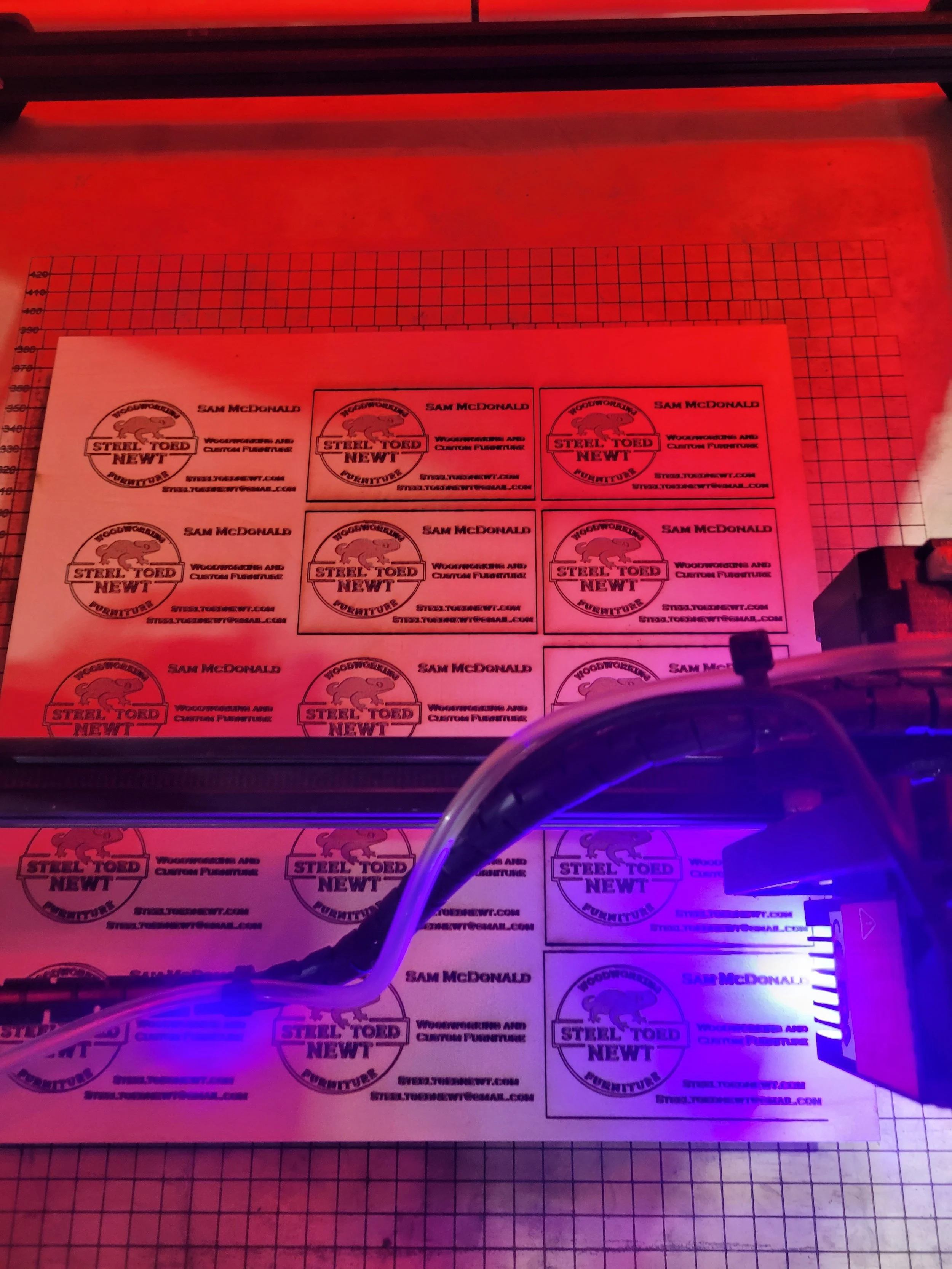 Two sheets of wooden business cards in batch production on Ortur laser