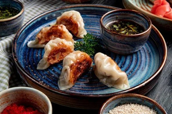 Dumplings (饺子 jiǎozi) - Wealth and Good Fortune