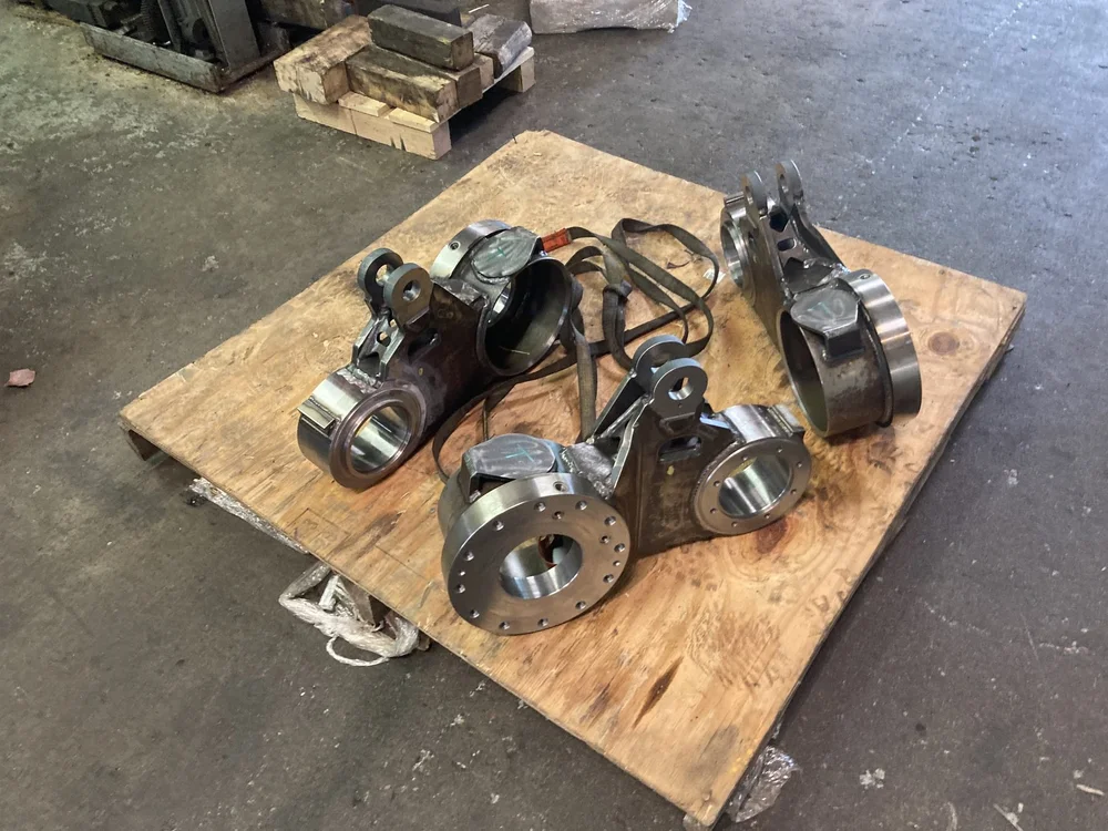 Machined trunnion weldments with bearing bores, set of three
