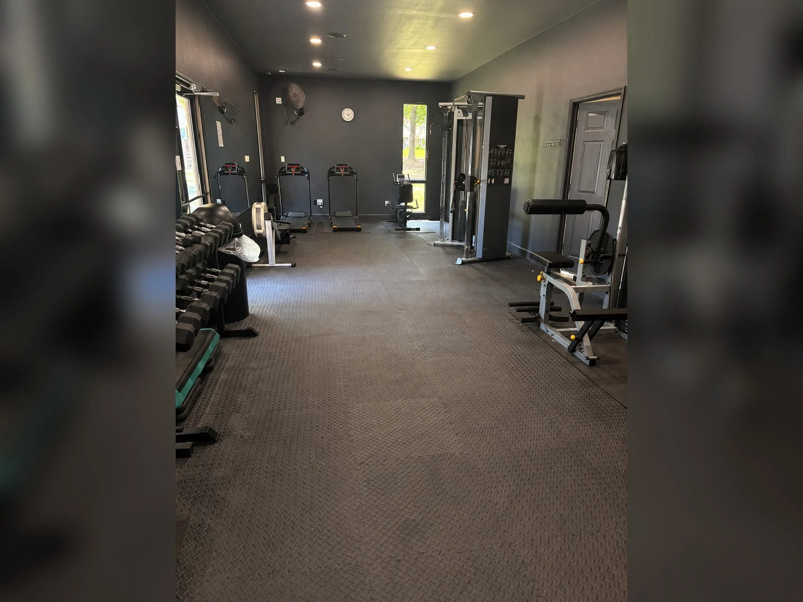 Otter Creek fitness room with treadmills, weights, and exercise machines