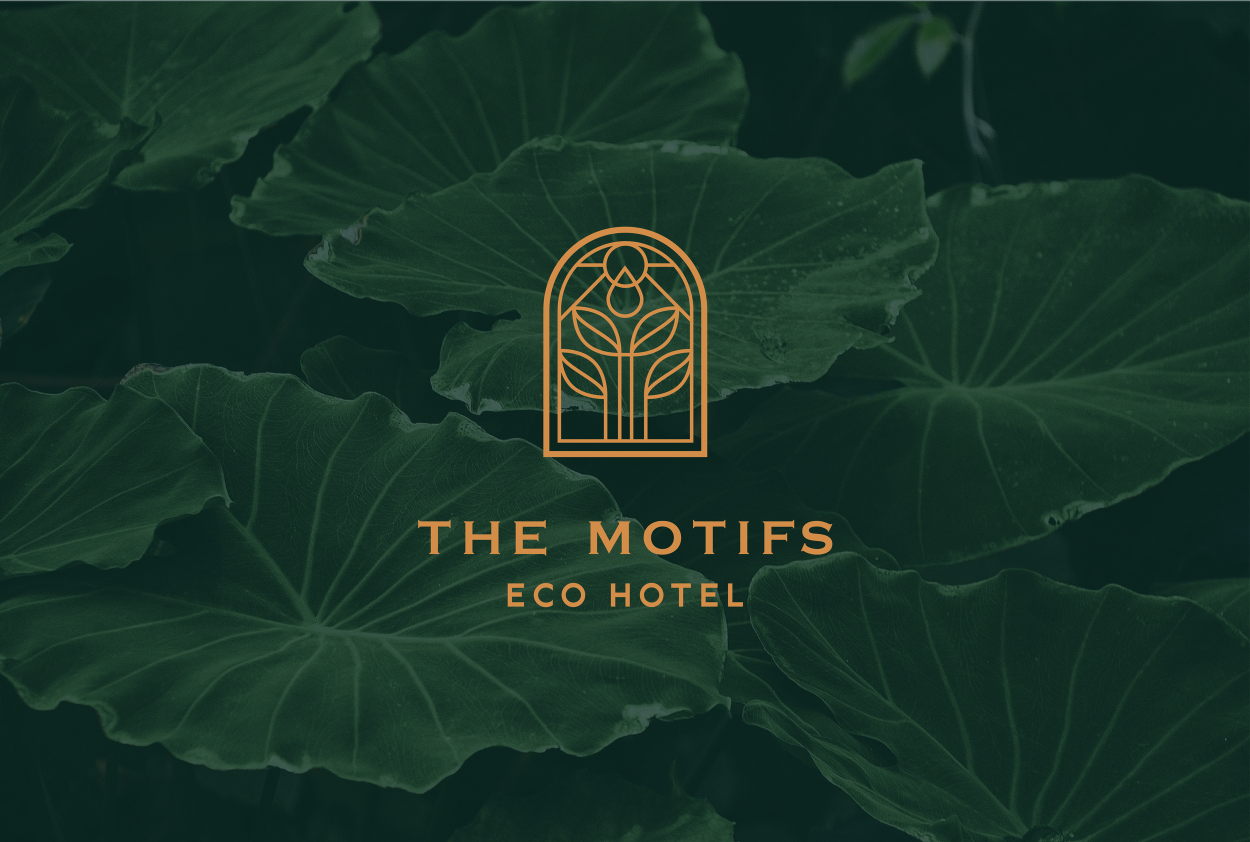Logo for The Motifs Eco Hotel featuring a stylized leaf and droplet design against a background of green tropical leaves.