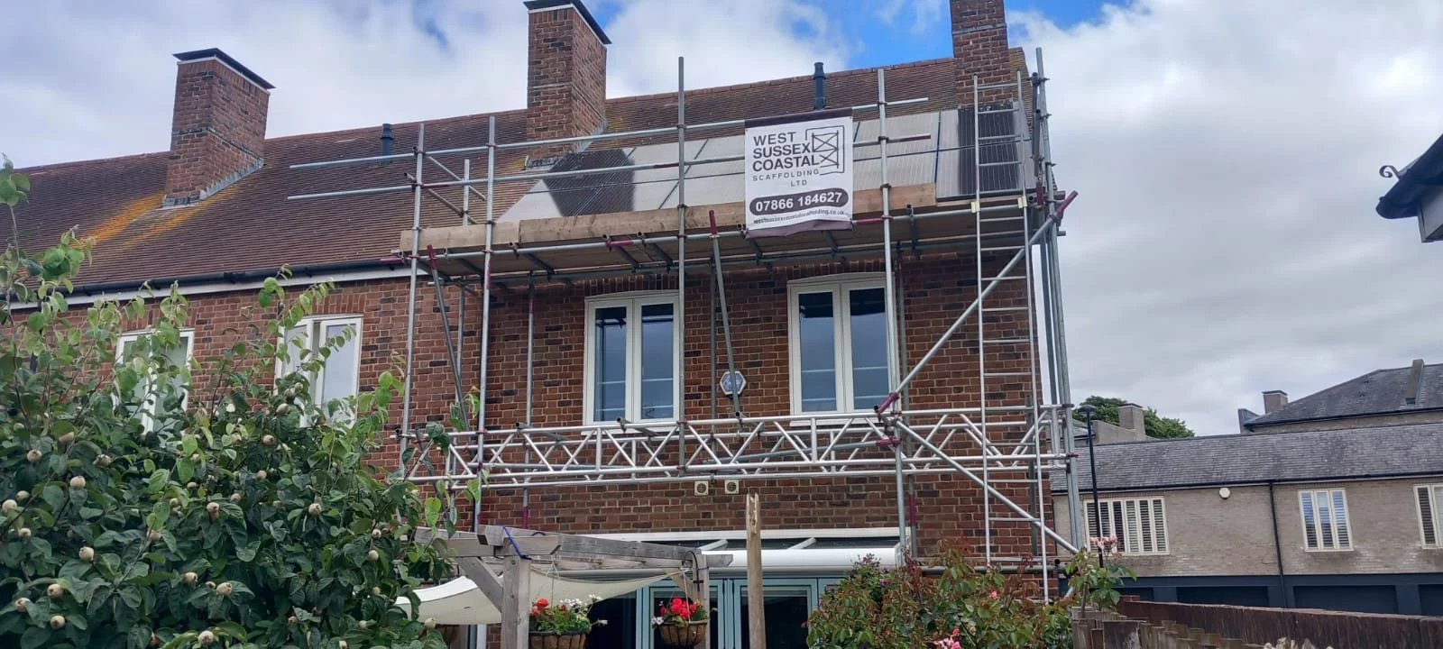 Domestic front elevation scaffolding providing safe access for exterior renovation, painting and property maintenance works. West Sussex Coastal Scaffolding Ltd.