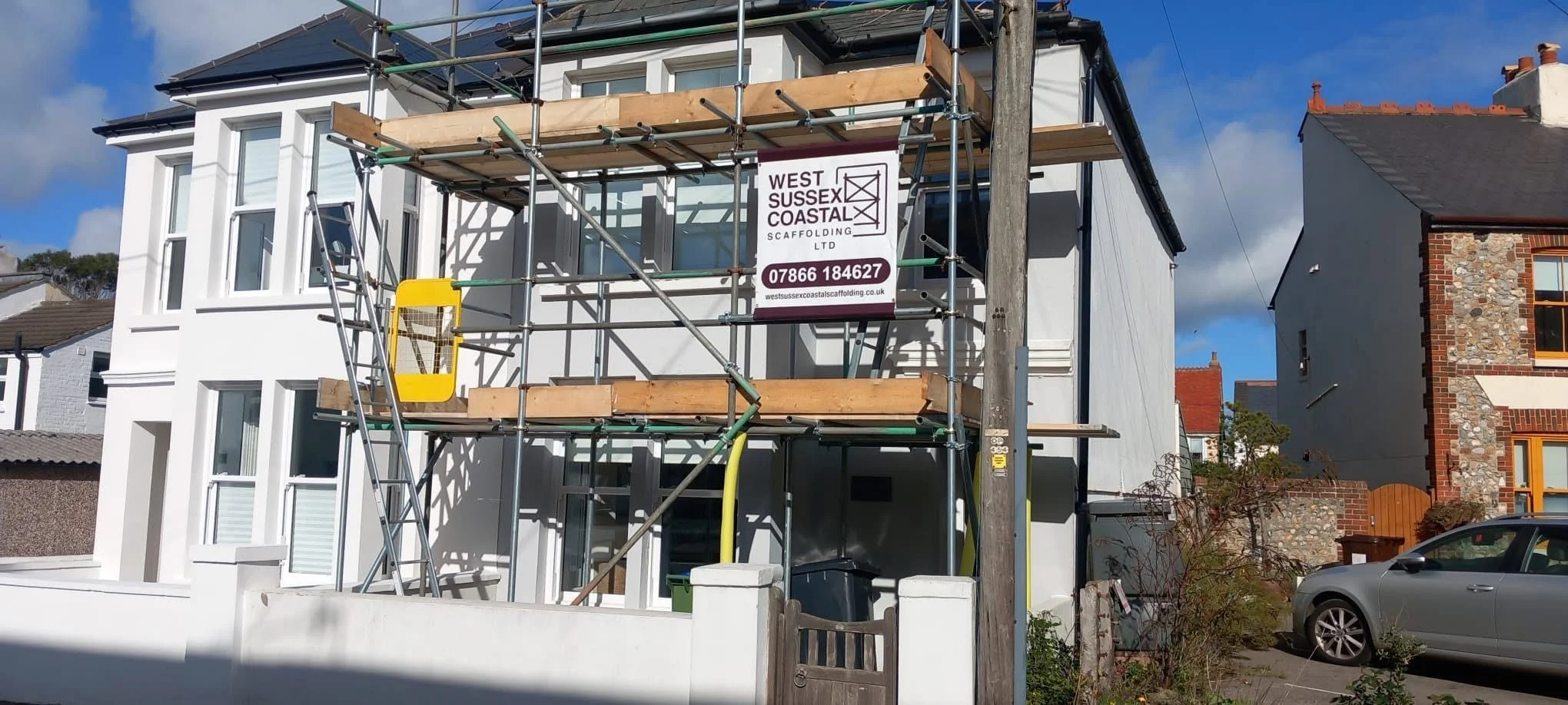 Front elevation scaffolding erected on a residential property to provide safe access for exterior building and renovation works. West Sussex Coastal Scaffolding Ltd.