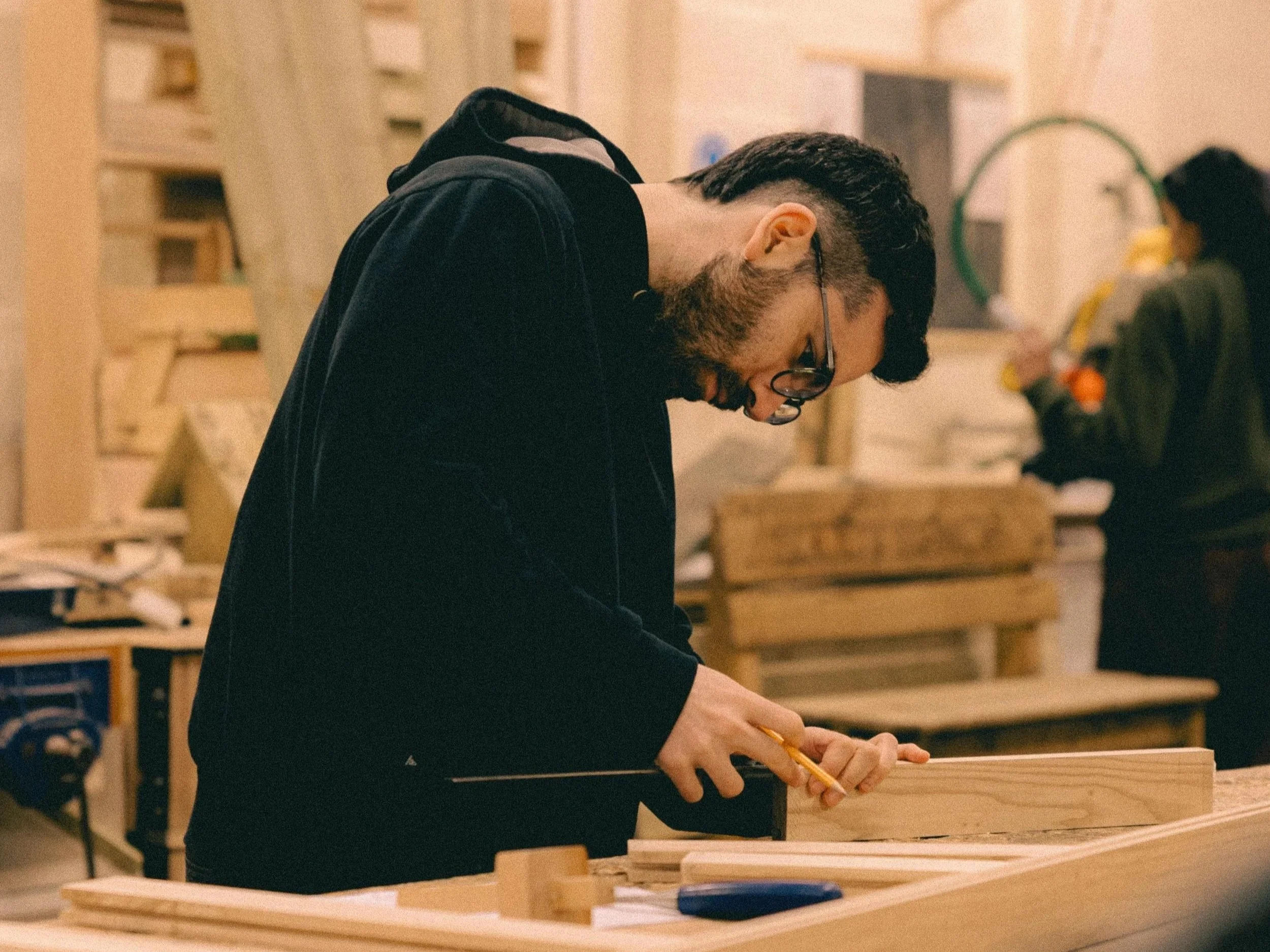 An attendee at Boomerang Woodworking Open Bench wood working session working on a bespoke project