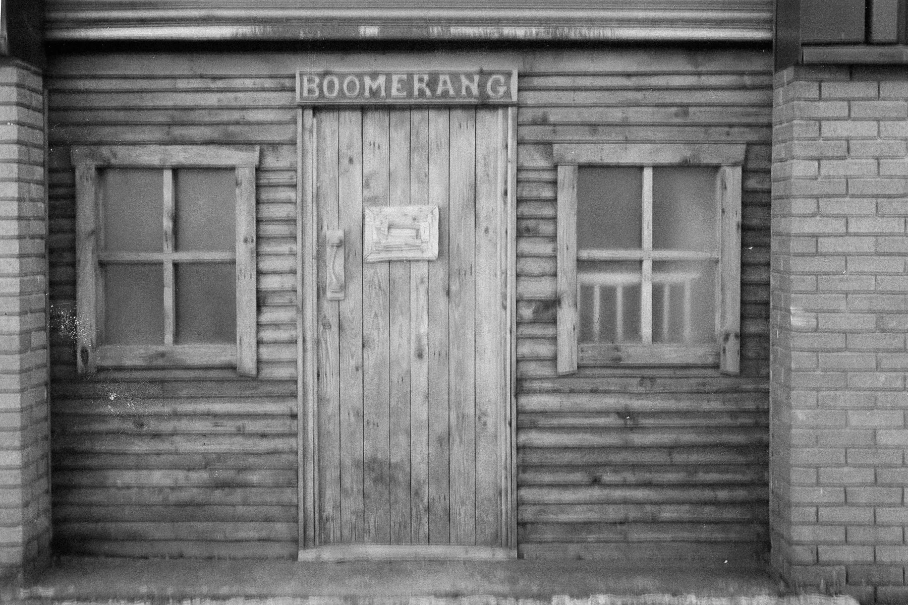 Historic photos of Boomerang Woodworking at it's conception. (image of the front of the workshop, front door with 'Boomerang' sign
