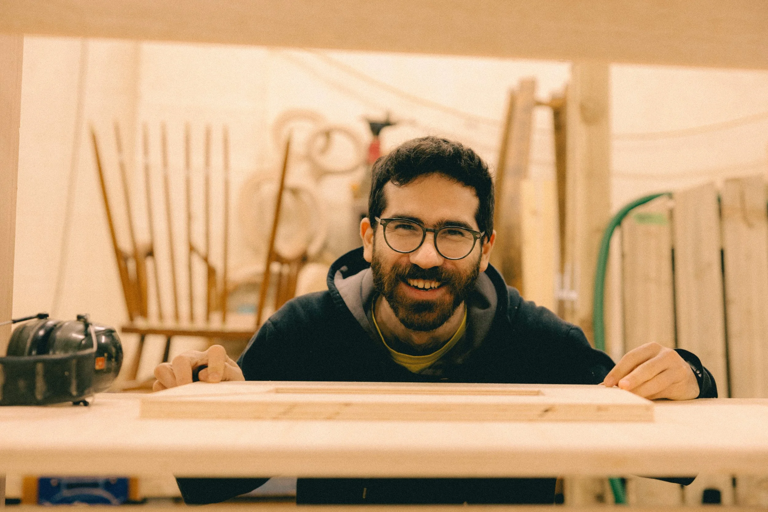 A Boomerang Open Bench attendee smiling with his creation