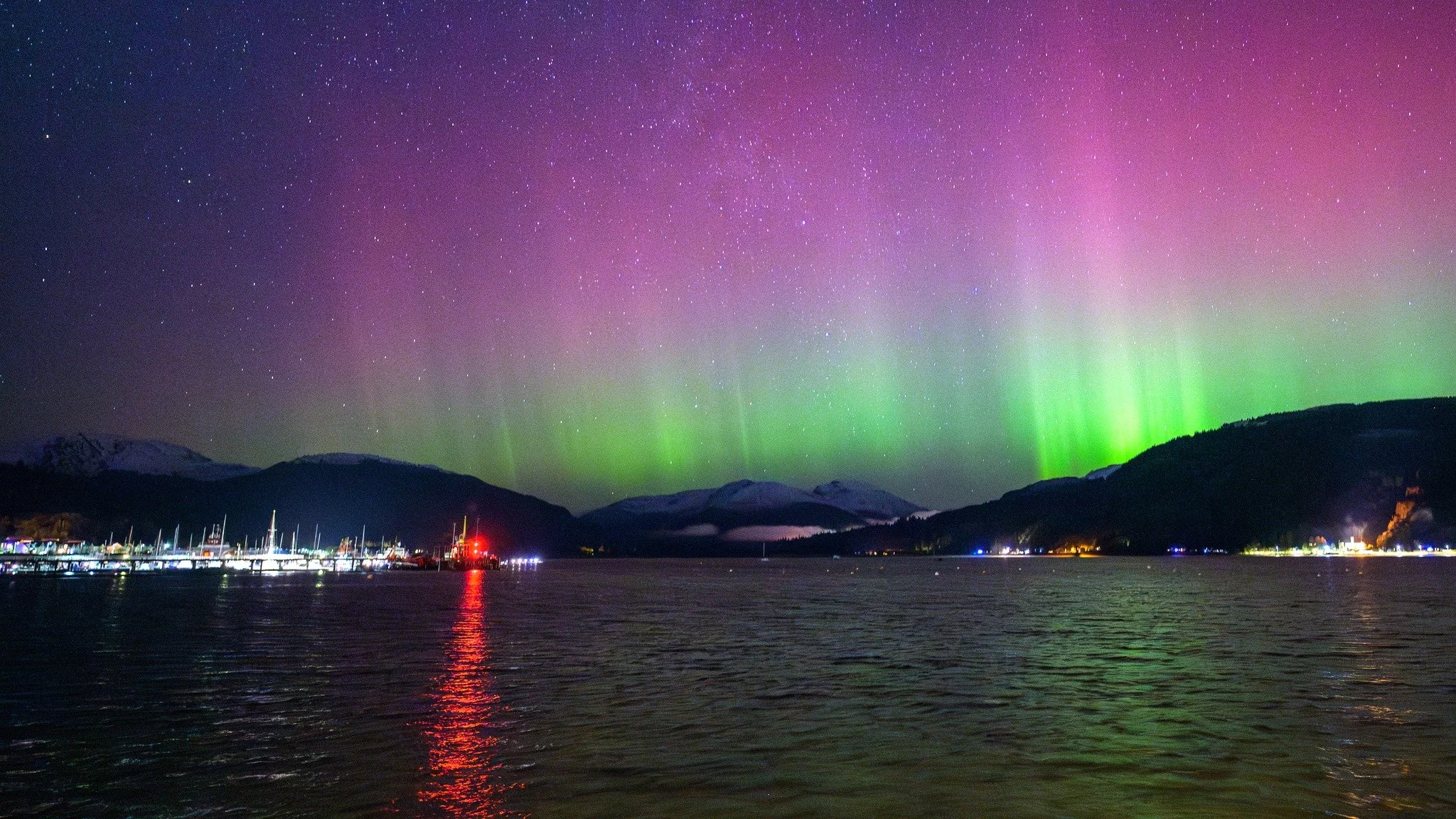 The northern lights across Holy Loch Marina