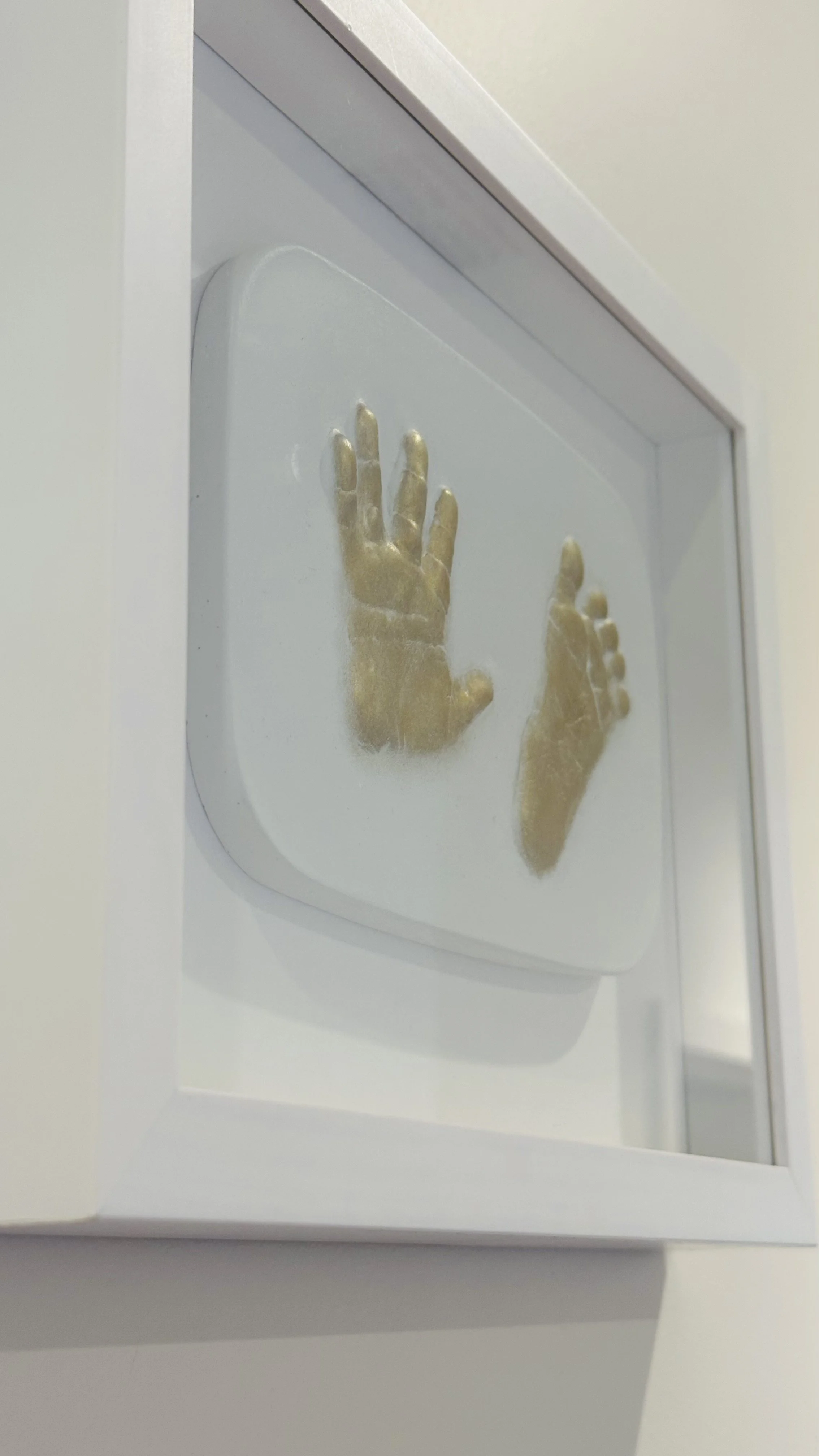 side-gold-white-plaster-impression-baby-handprint-footprint.JPG