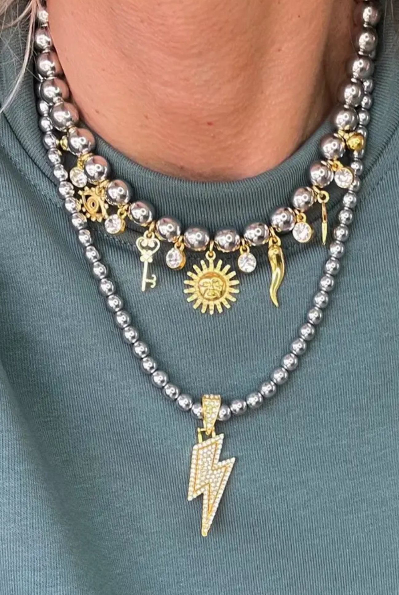Silver lightning and charm necklace