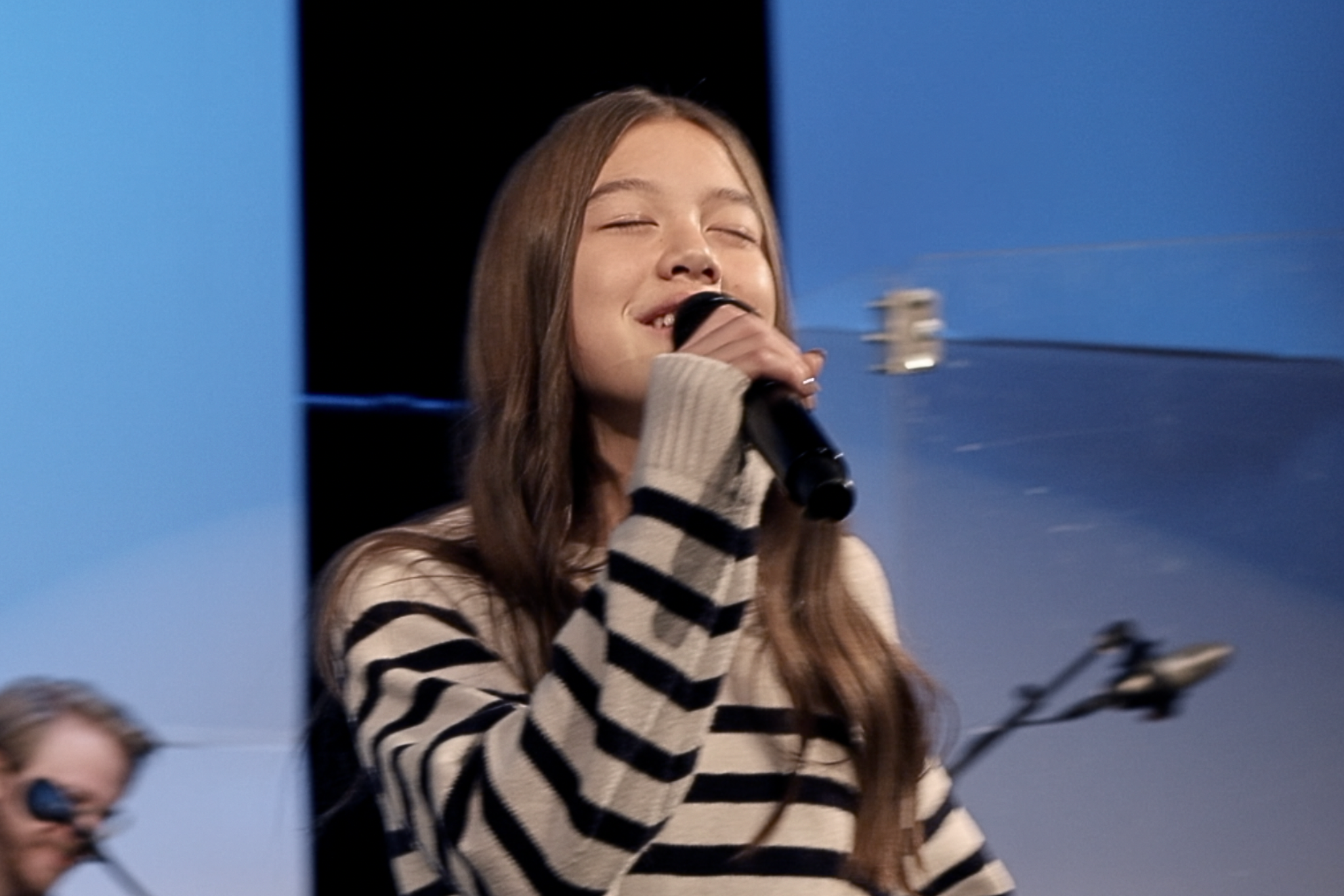 Reese singing worship team.png