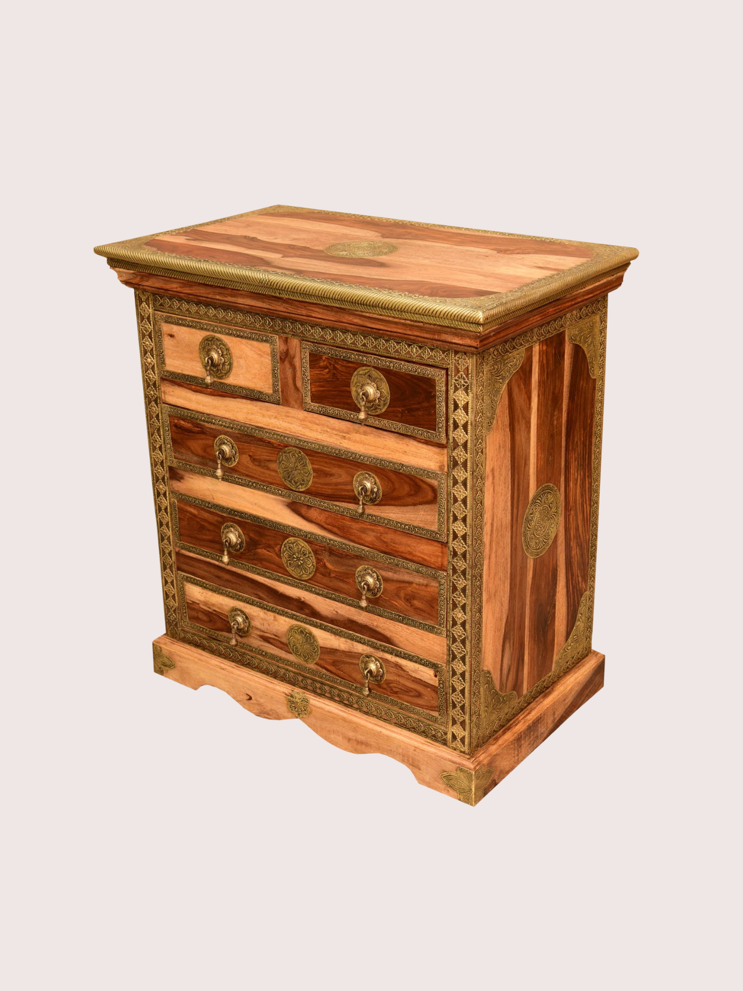 An antique wooden chest of drawers with intricate gold accents and ornate handles.