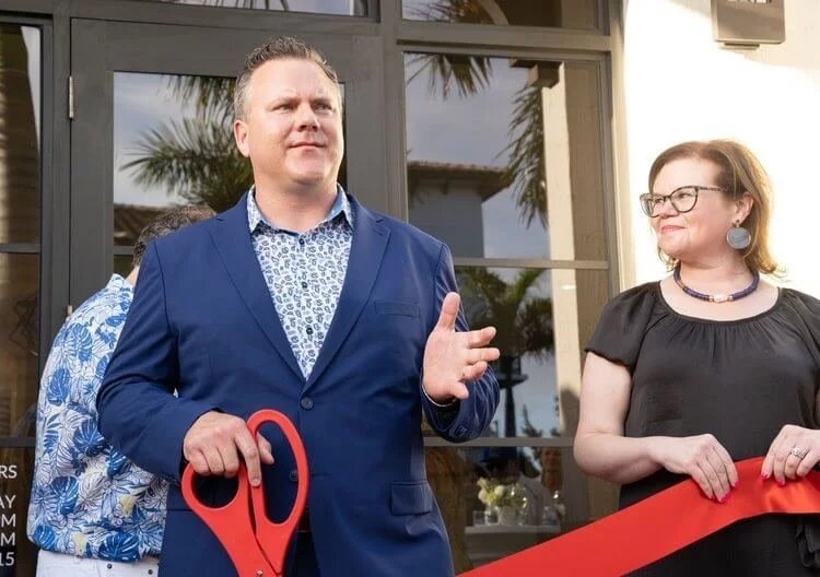 paul-ribbon-cutting.jpeg