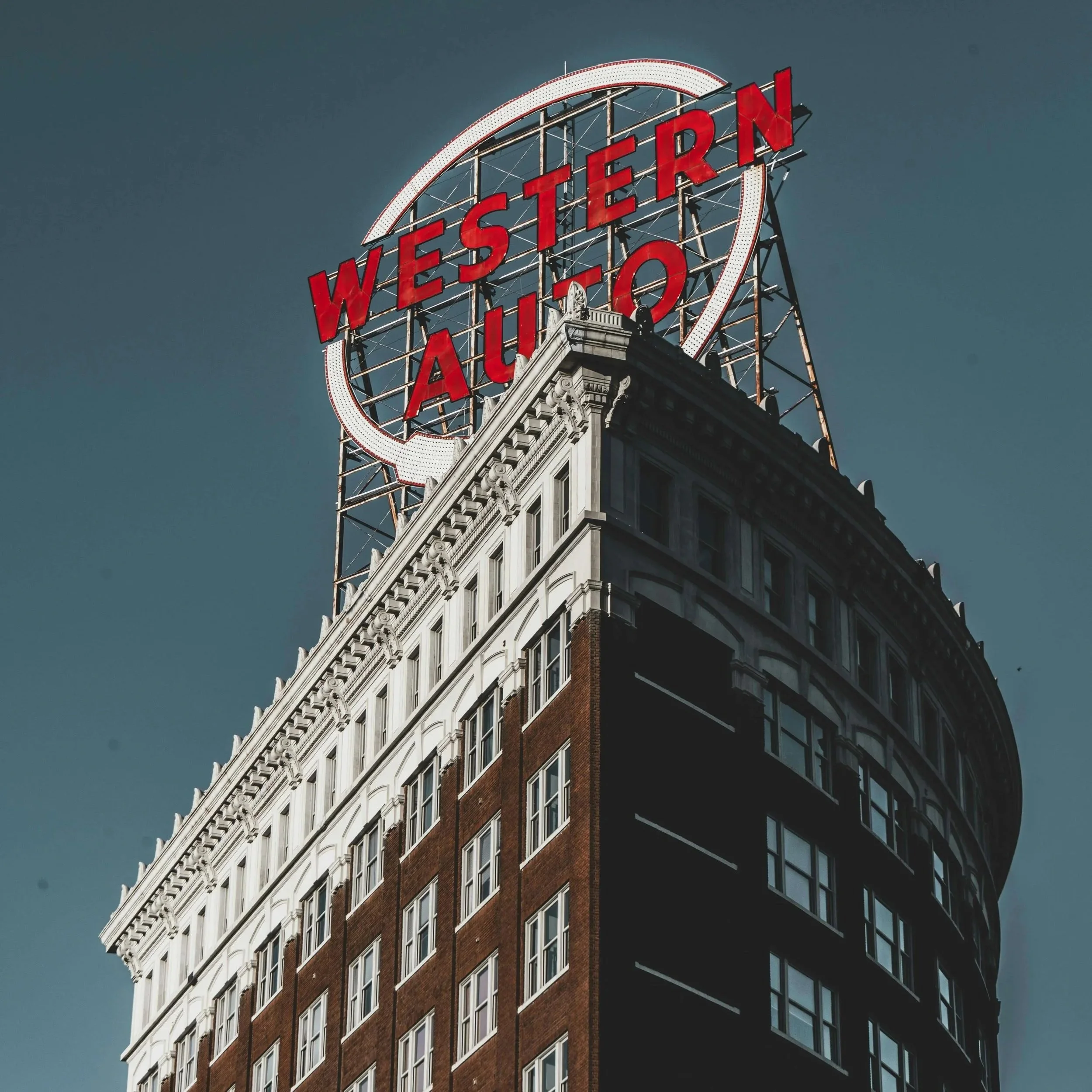 Western Auto building sign in Kansas City, representing local professional communication coaching services for Kansas City professionals and teams.