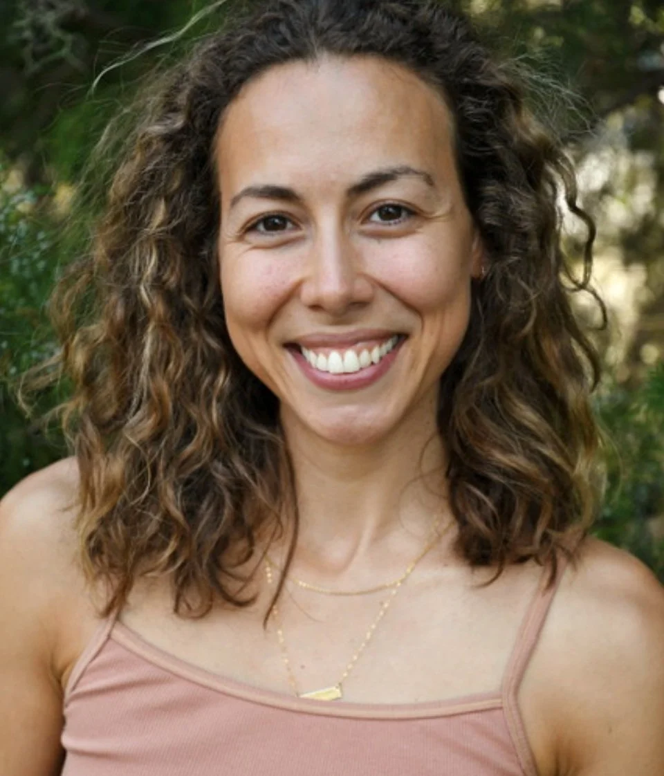 Headshot of  Anais Ortiz, smiling kindly