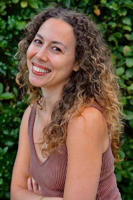 Headshot of Anais Ortiz, smiling kindly