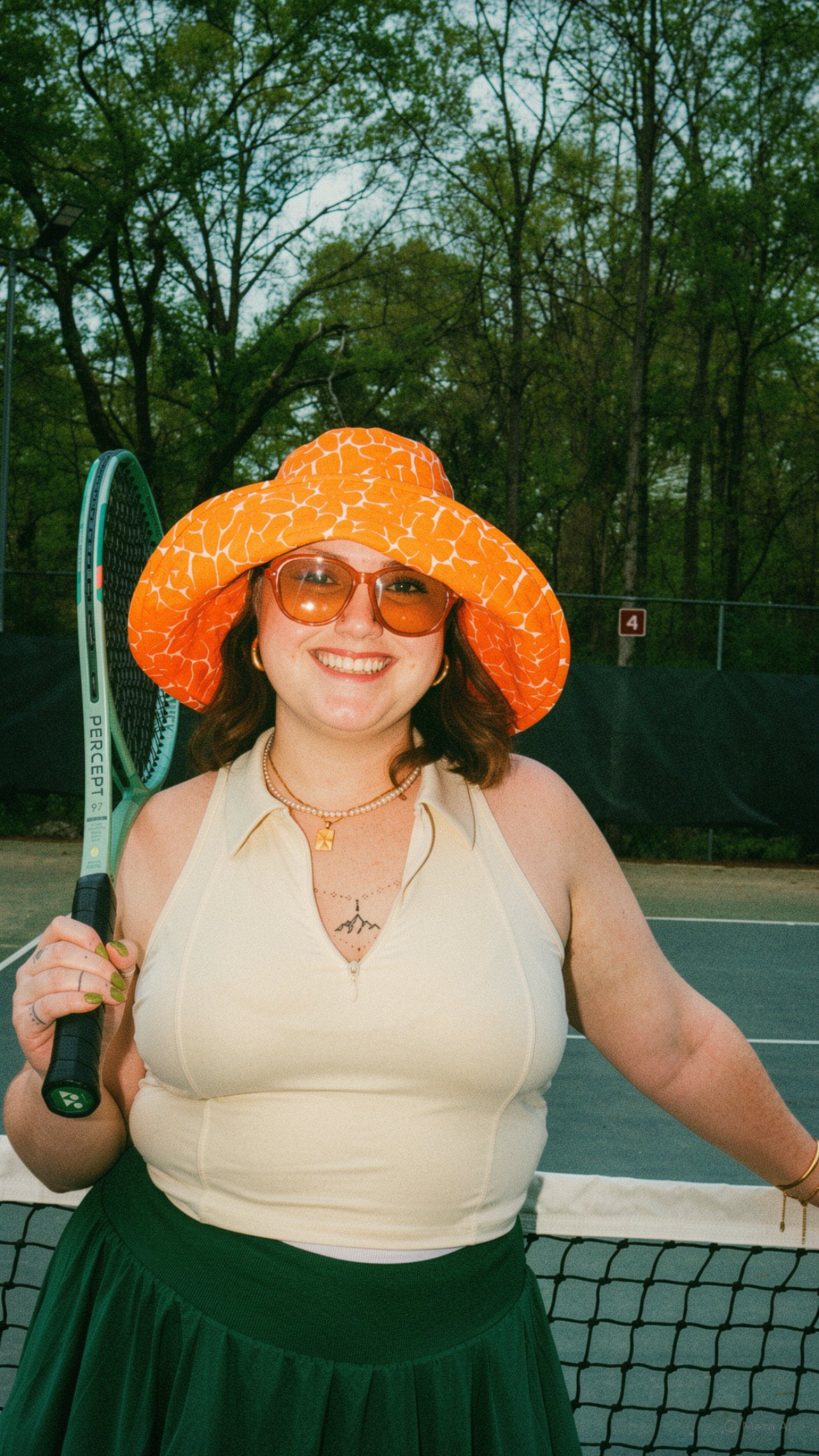 Meaghan, Fractional CFO, posing on a tennis court.