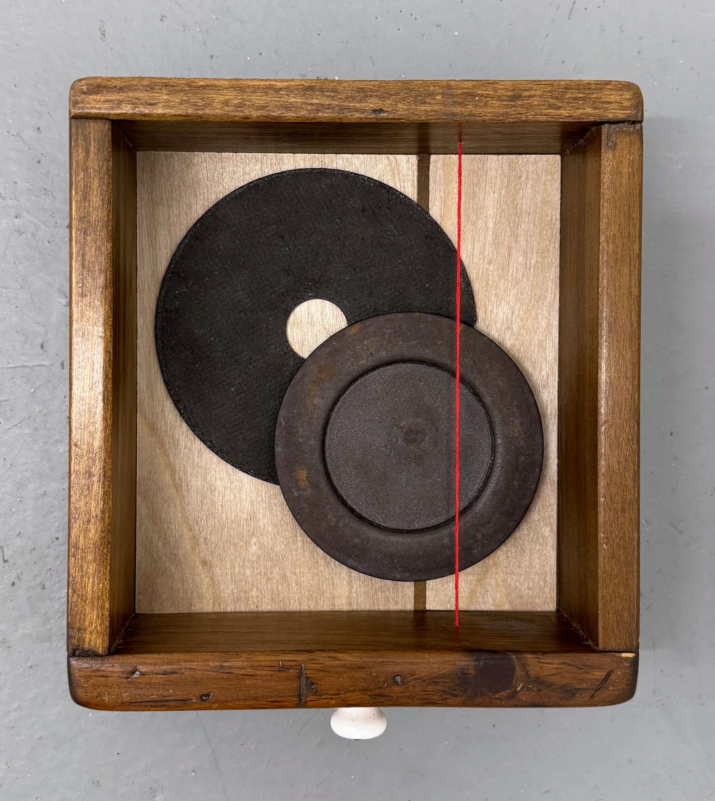 Untitled (drawer 1), 2025. Found objects, birch veneer, embroidery floss, 8.5 x 7 x 3 inches.