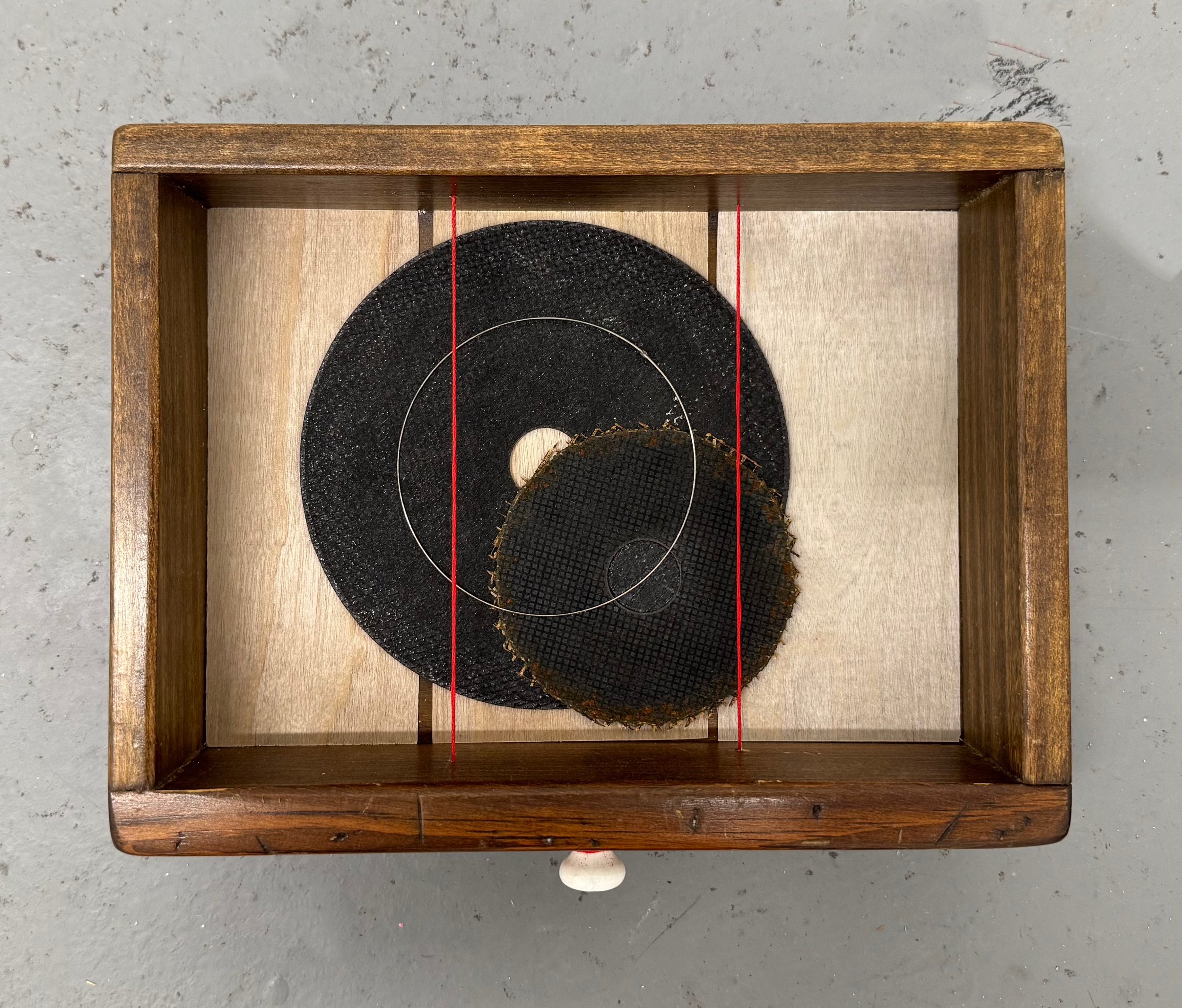 Untitled (drawer 2), 2025. Found objects, birch veneer, embroidery floss, 8.5 x 10.25 x 3 inches.