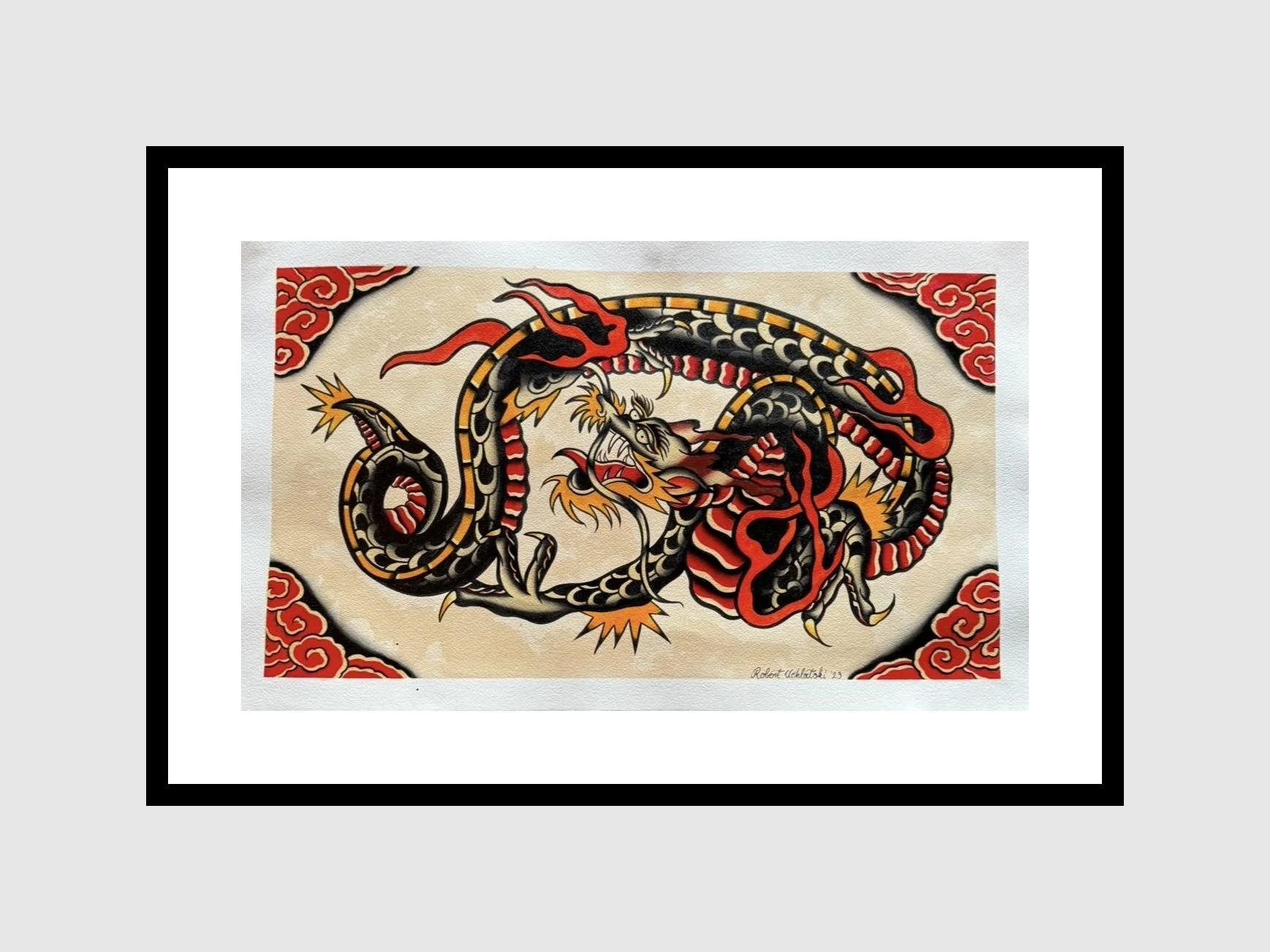 Tattoo-style artwork of dragon in vibrant colors with red accents.