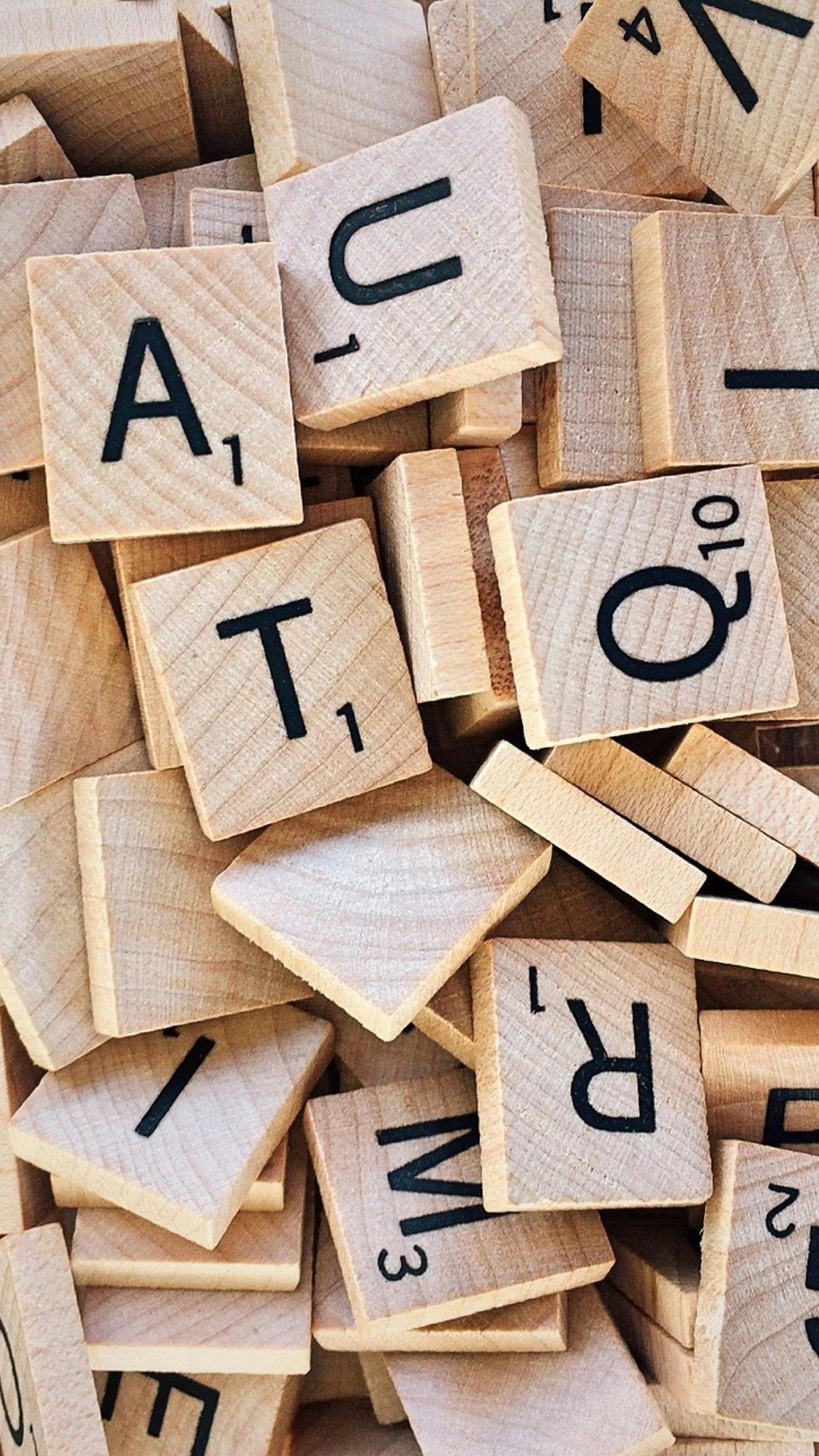 A pile of wooden scrabble pieces