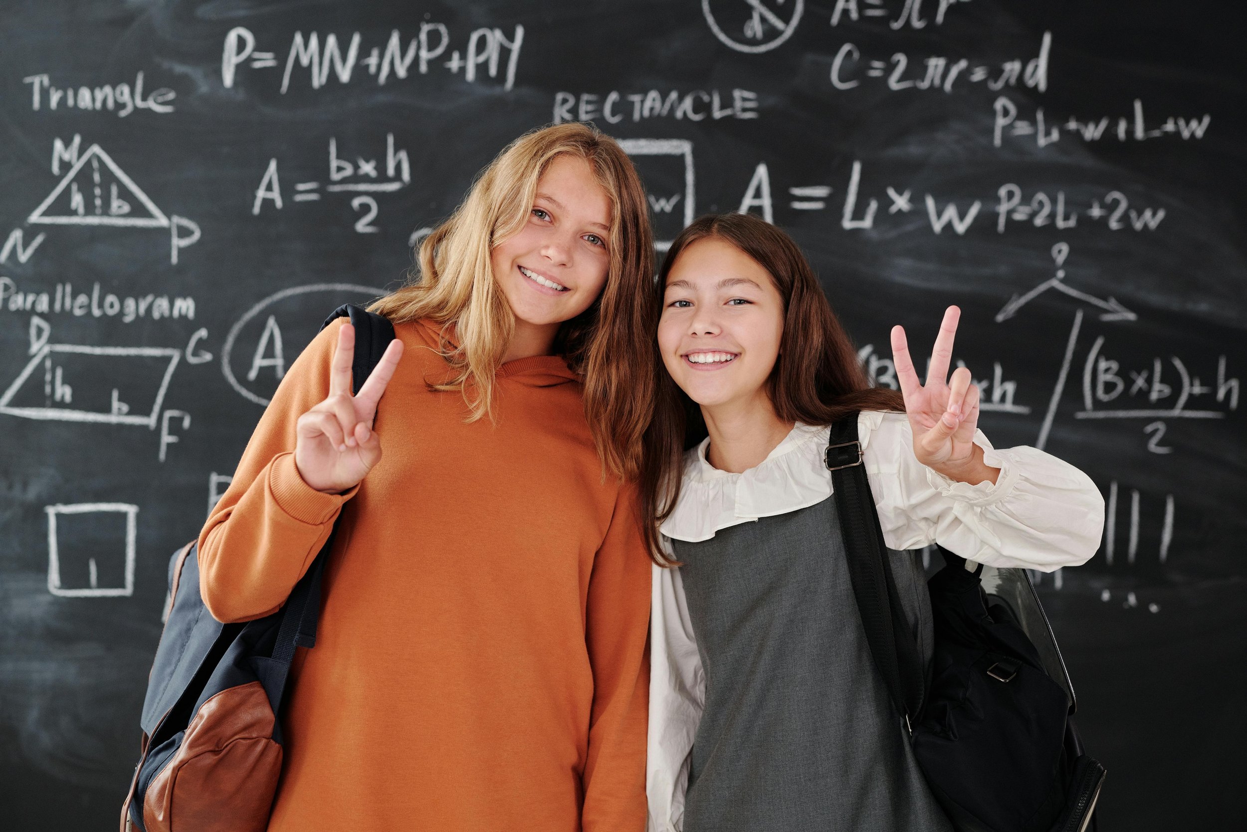 Two students smiling at the camera