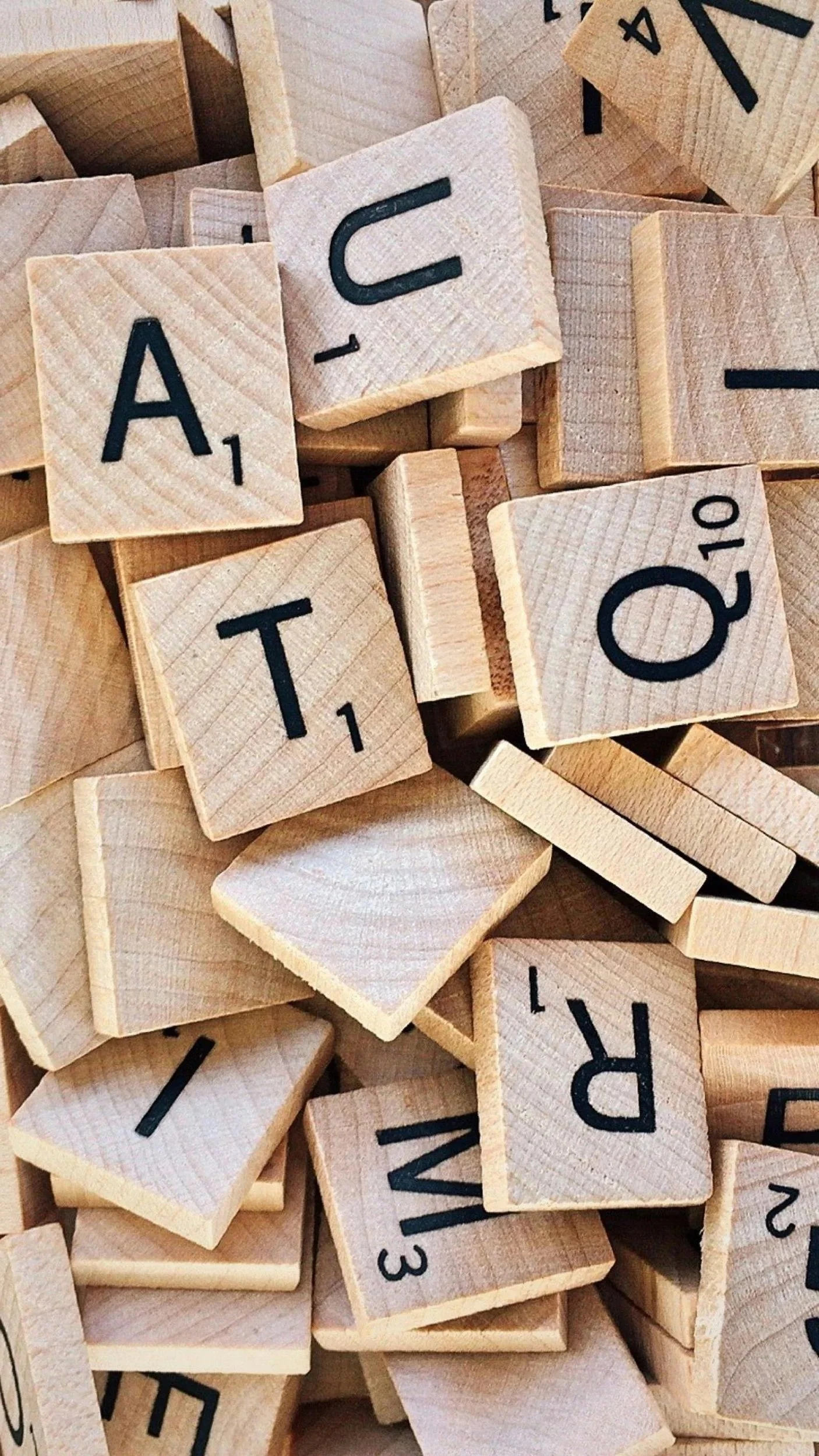 A pile of wooden scrabble pieces