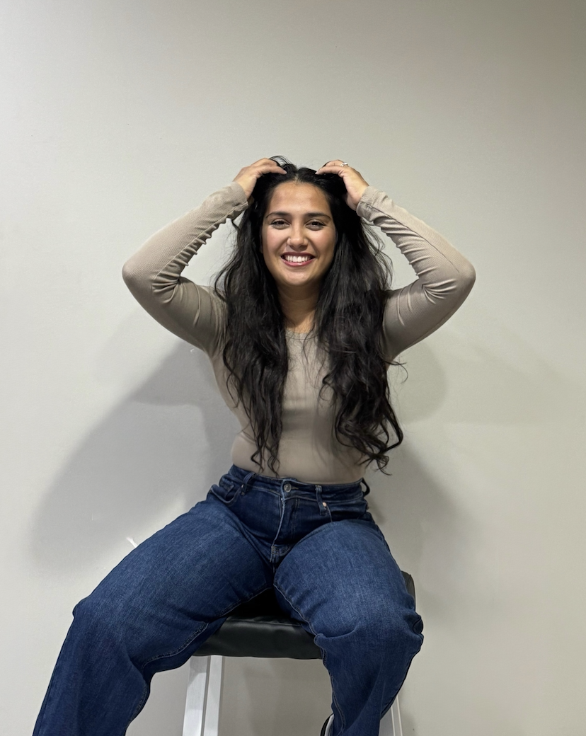 Portrait of Aziza, a nurse and grief coach, offering a gentle and grounding presence.