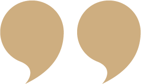 Two beige quotation marks on a white background.