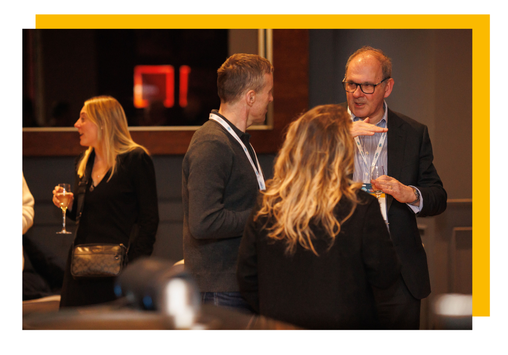 higher education leaders conversing in a relaxed setting