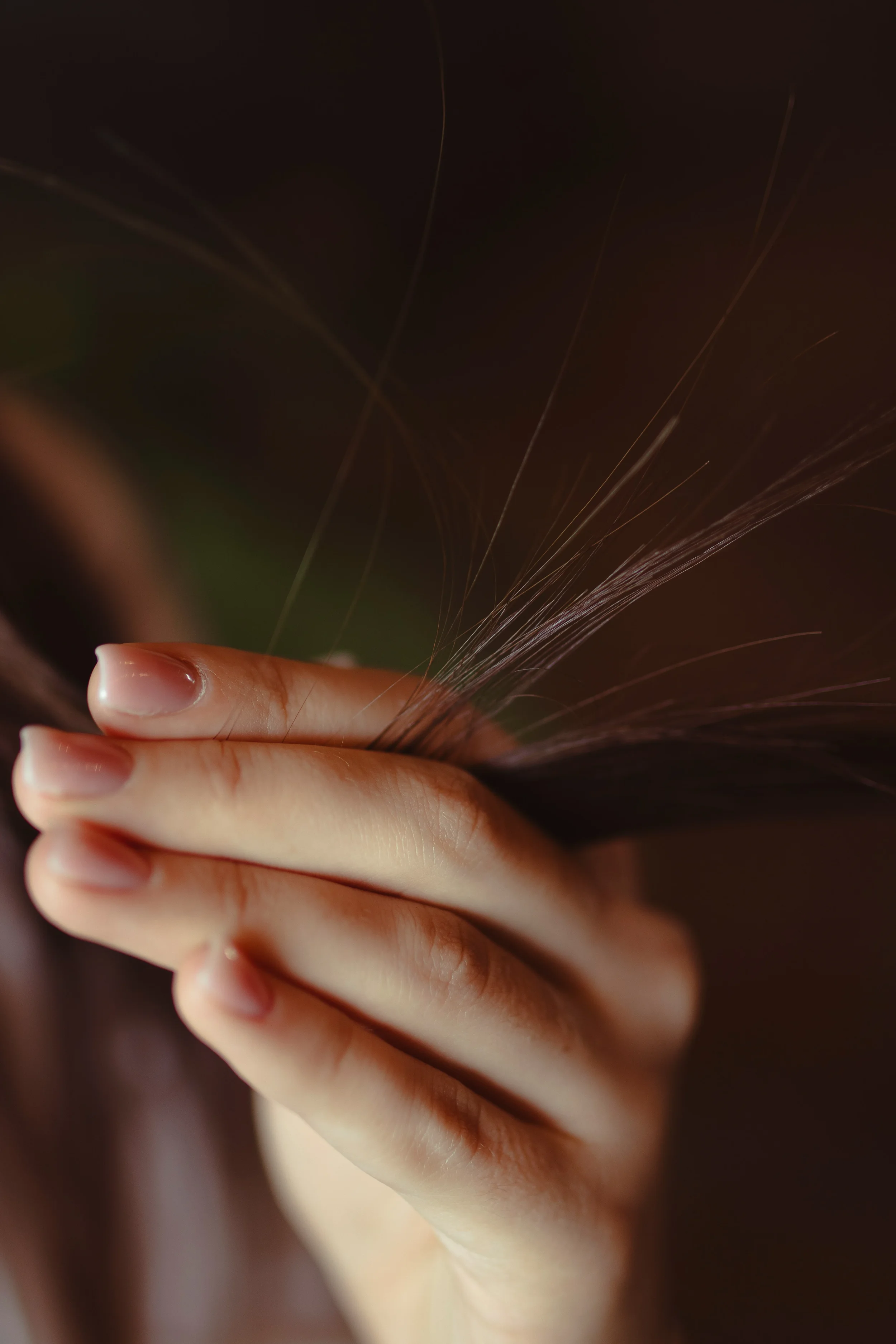 Fingers running through hair