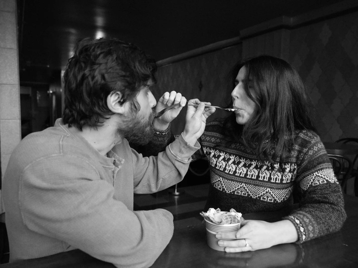 Jarae Comstock wedding photographer captures candid intimate moment for engagement shop at ice cream shop