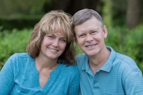 Diane Dultmeier and her husband Mike smiling together during a portrait session