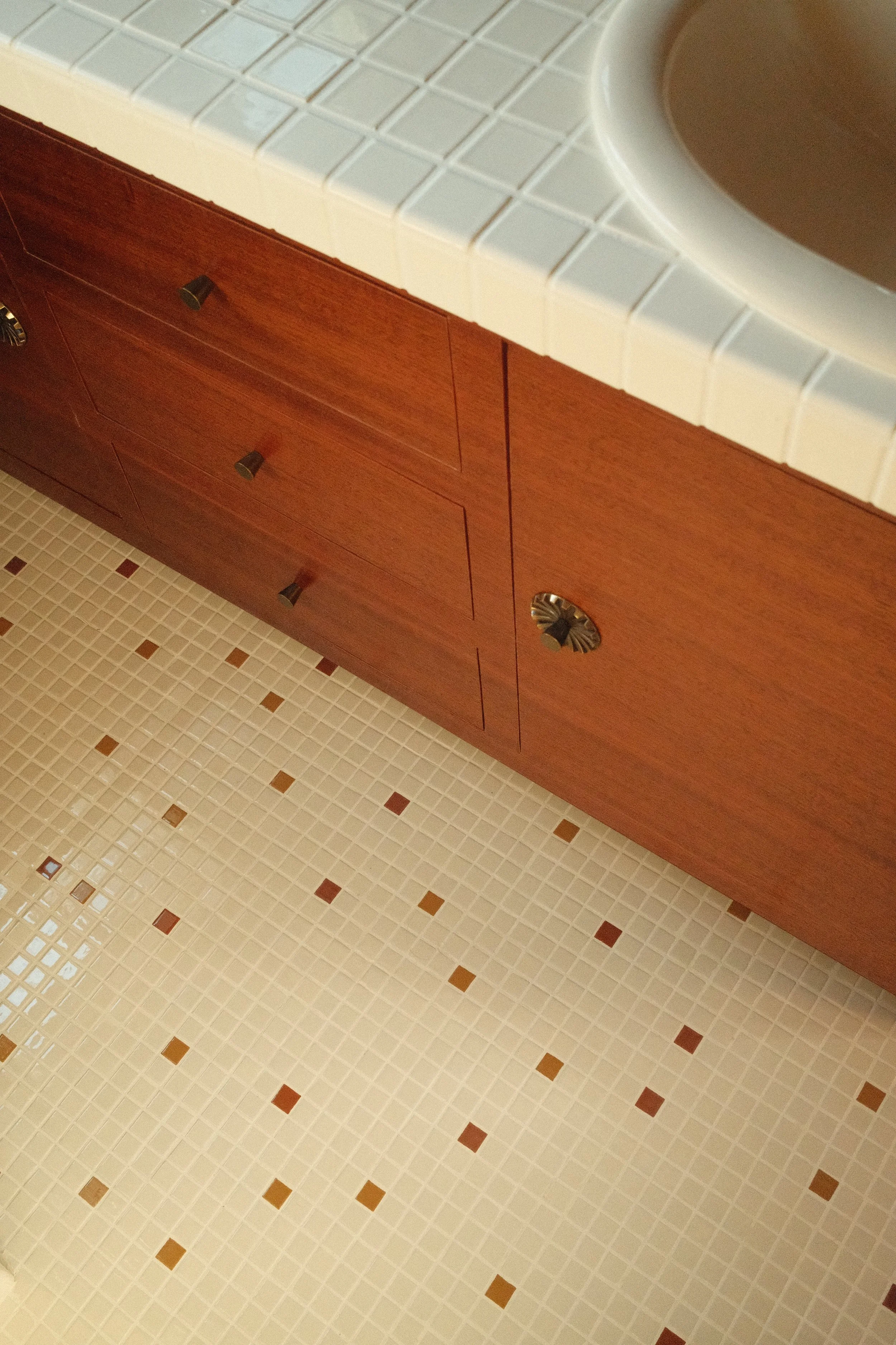 Unflipping vanity with tile countertop and 1x1 mosaic floor